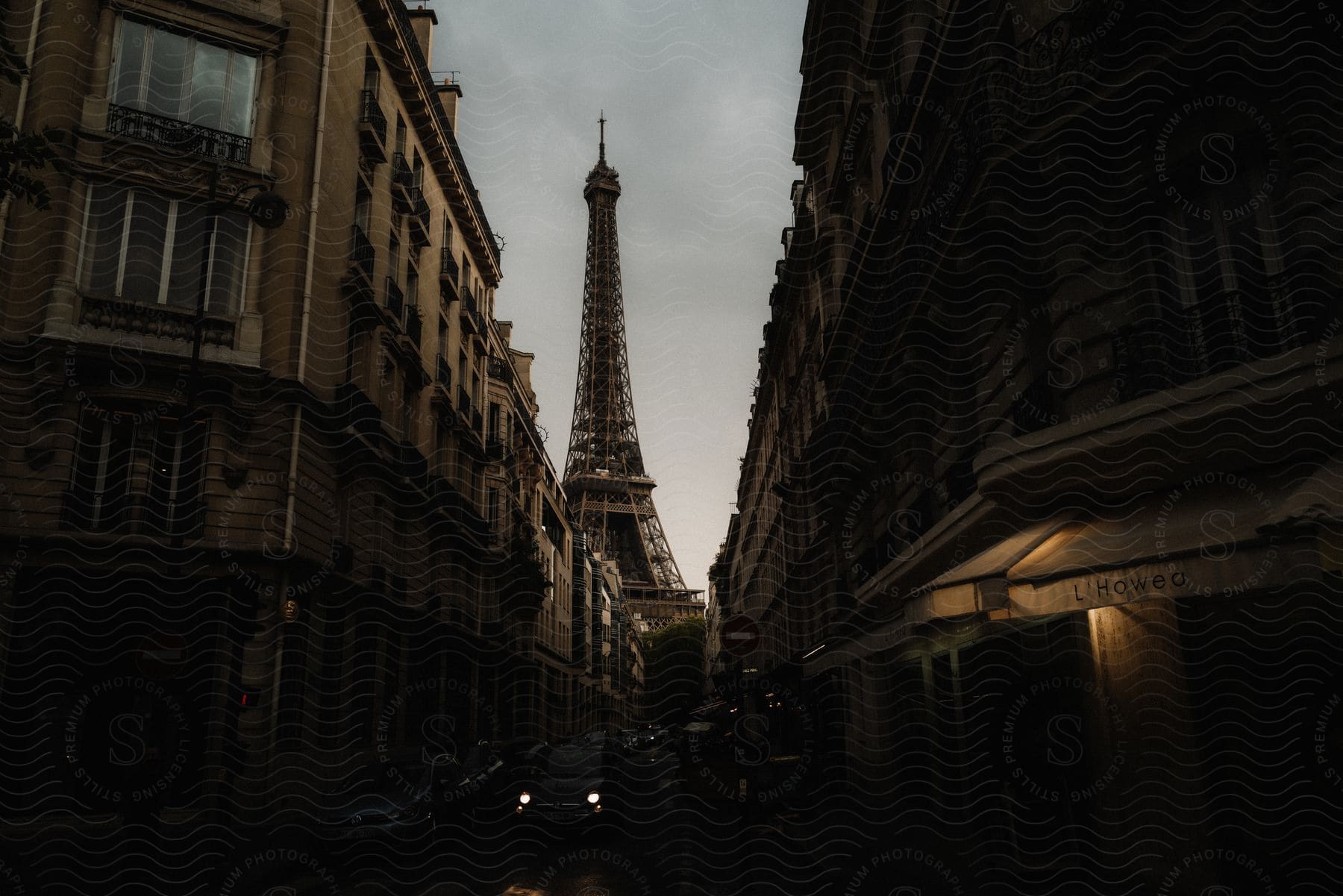 Eiffel tower seen from the streets at dusk or dawn in paris