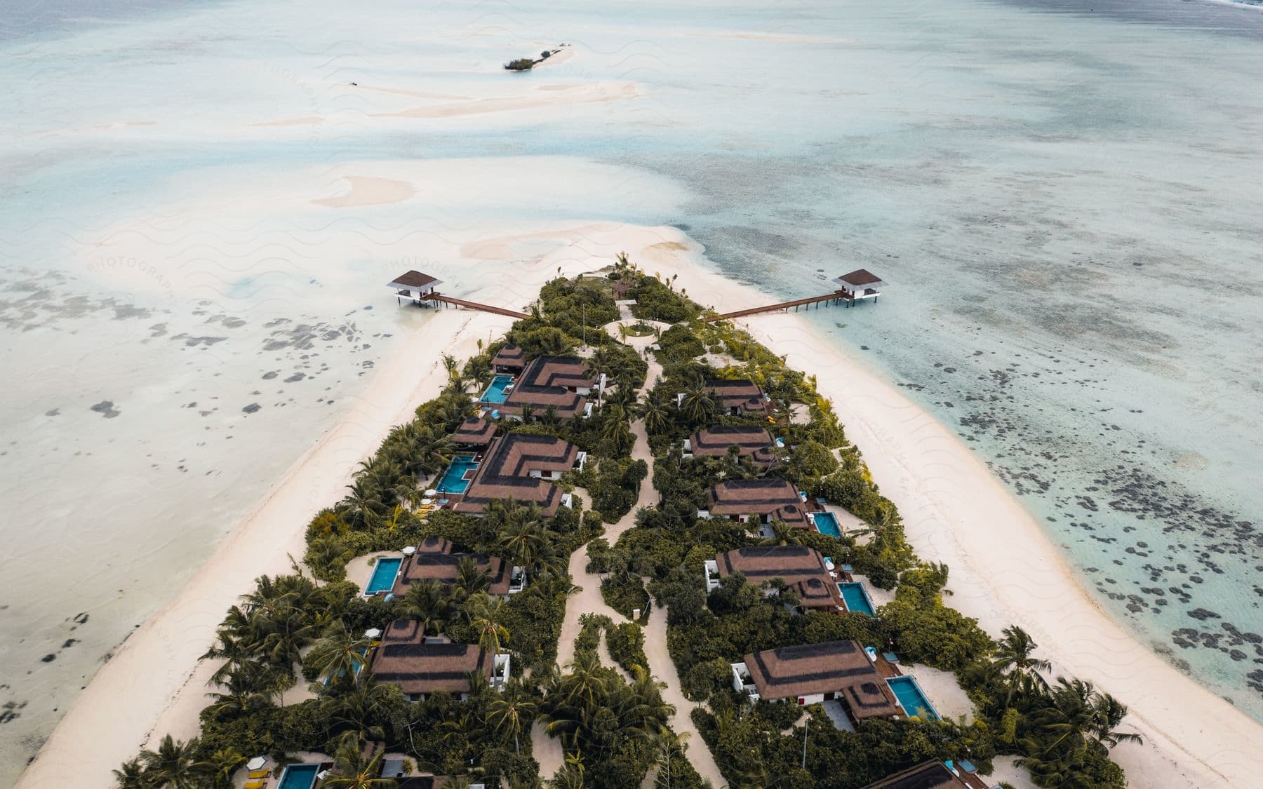 Paradise island with residences palm trees and white sand