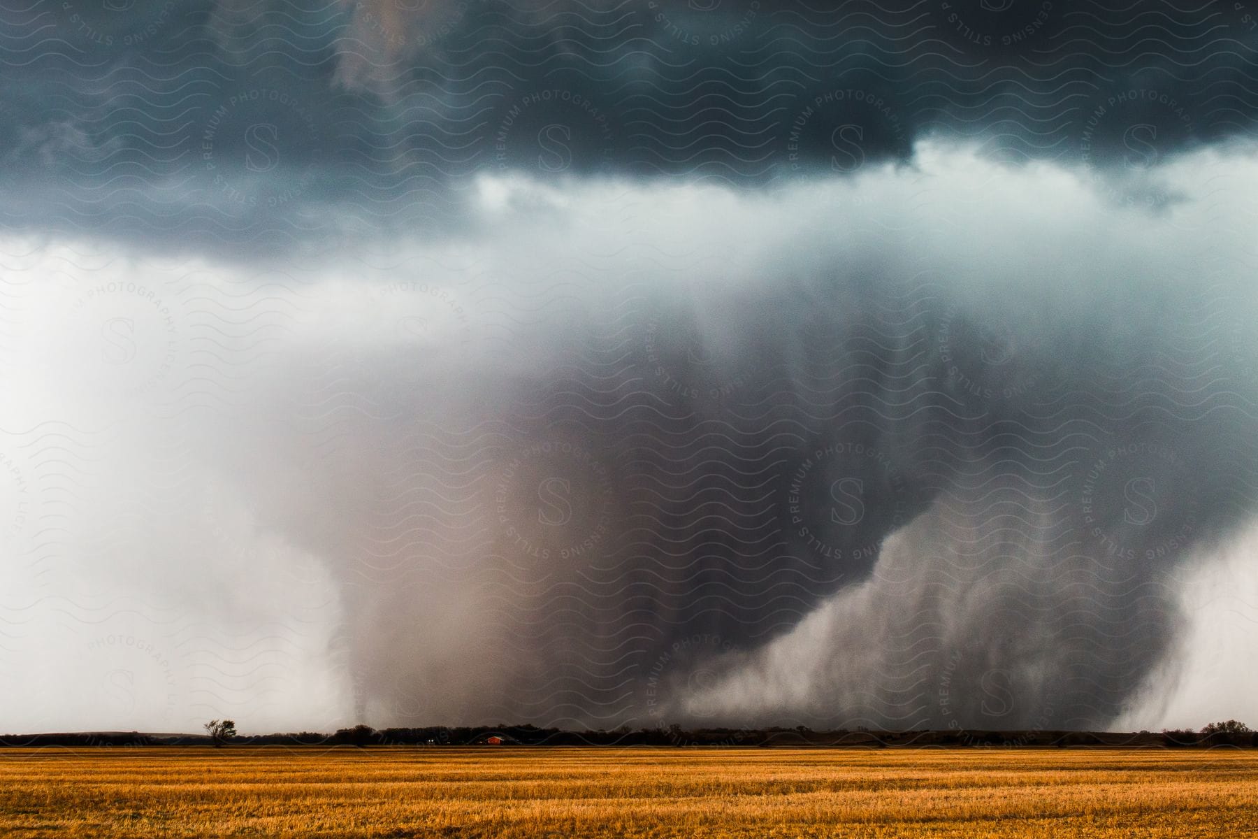 A tornado spins near tescott ks with a small suction vortice