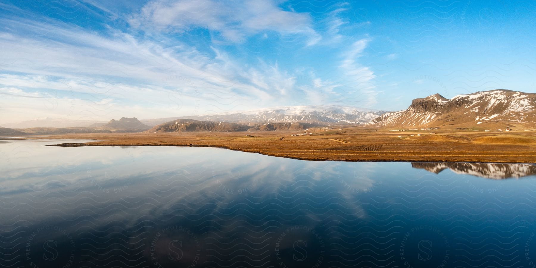 Serene lake and snowy mountains in iceland