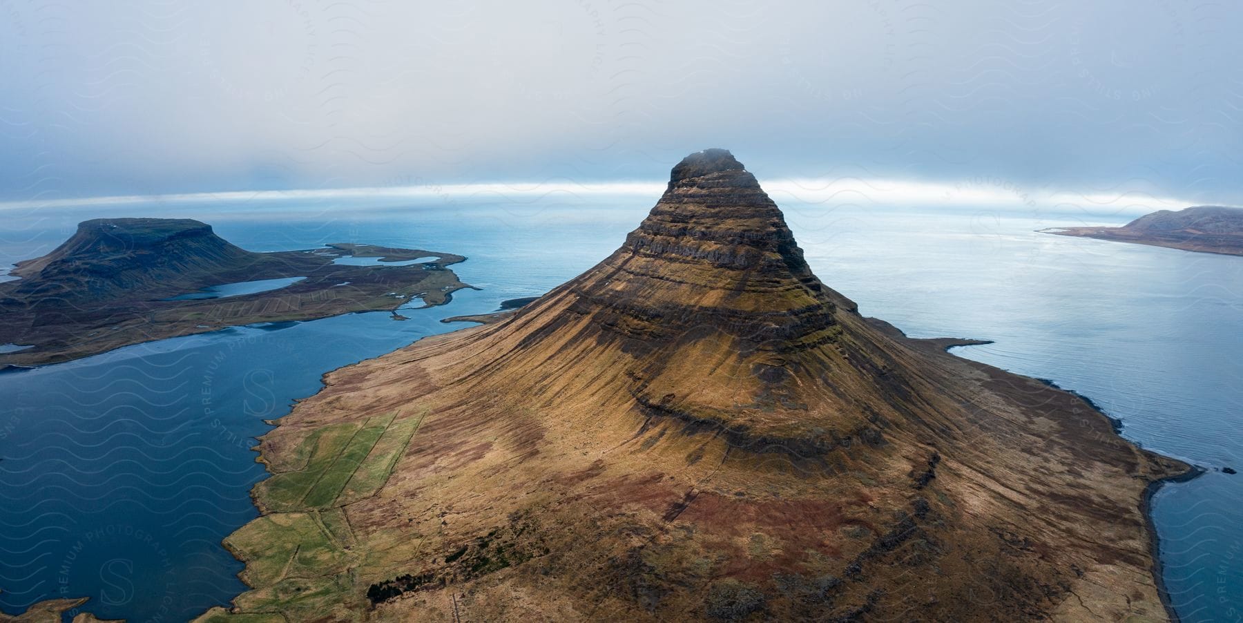 An island surrounded by ocean water seen from above