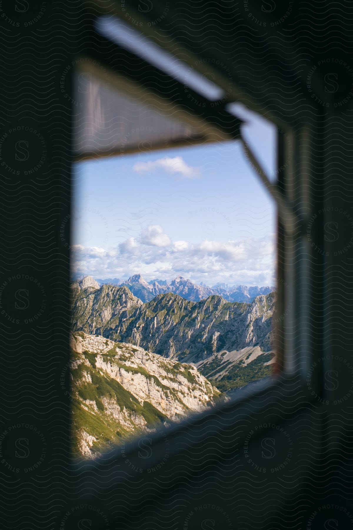 Rocky mountains on the horizon seen through a window