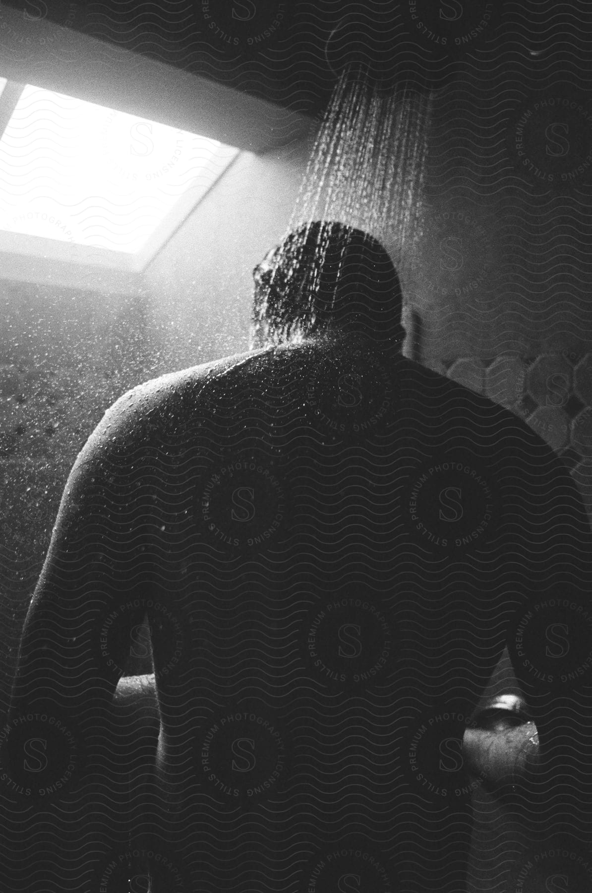 A person in a bathroom shower
