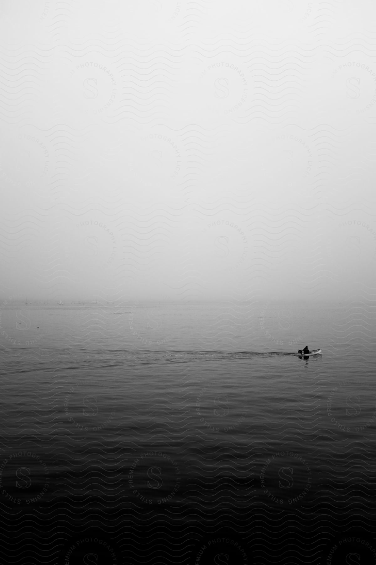 Black and white photograph of a boat on water