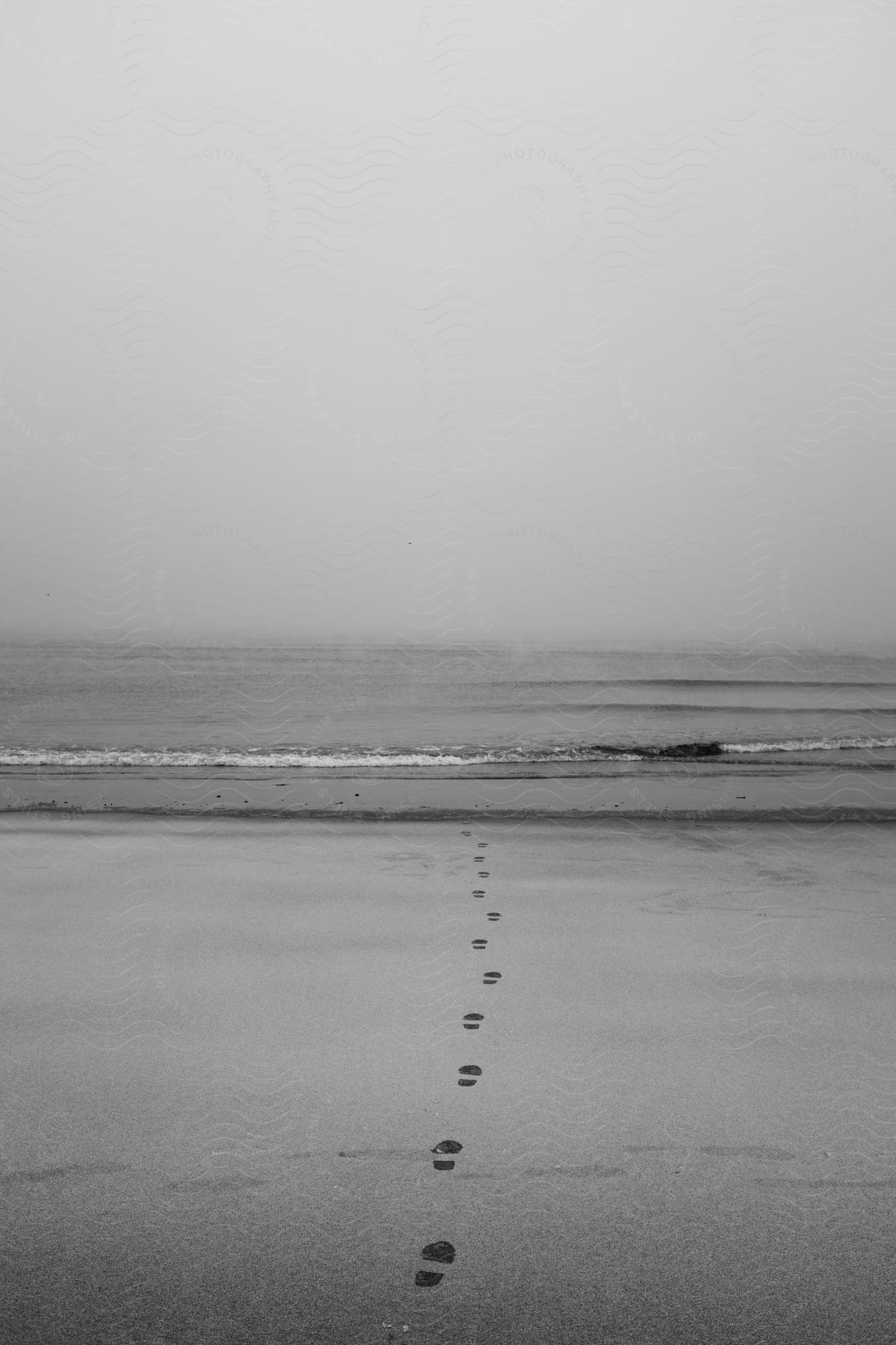 Beach with footsteps in the sand