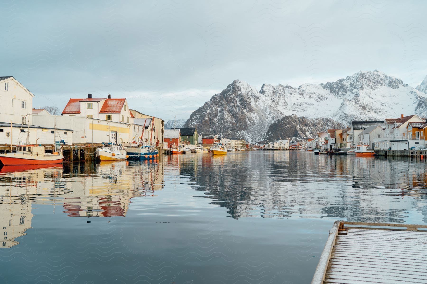 Coastal town with icy mountain and waterfront port