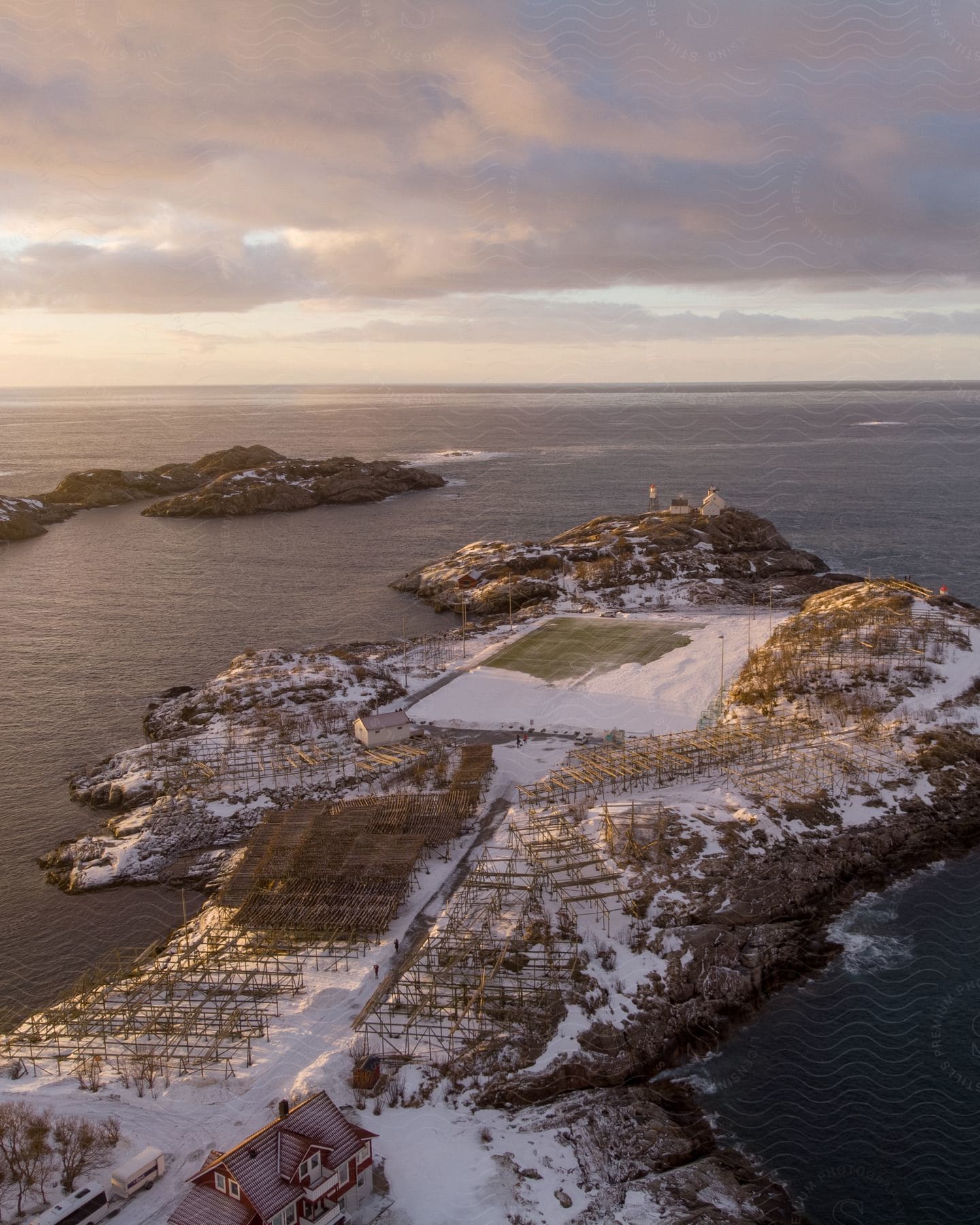 Snowy land jutting out into the sea on a cloudy day in norway