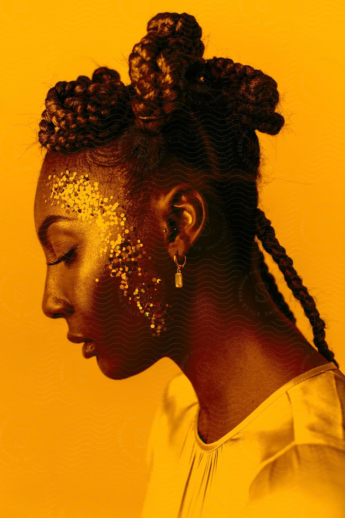 A woman wearing glitter and jewelry