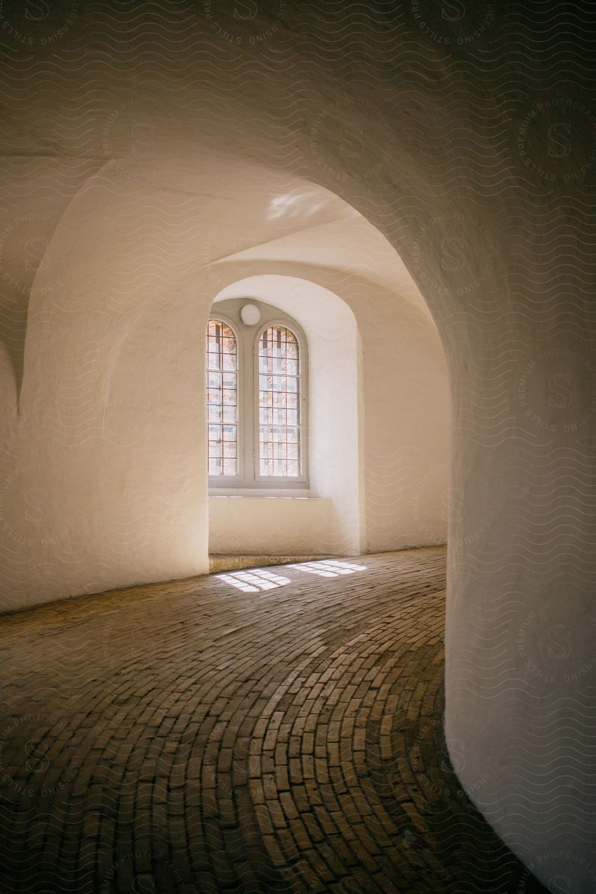 A classical style window on a curved sloped corridor