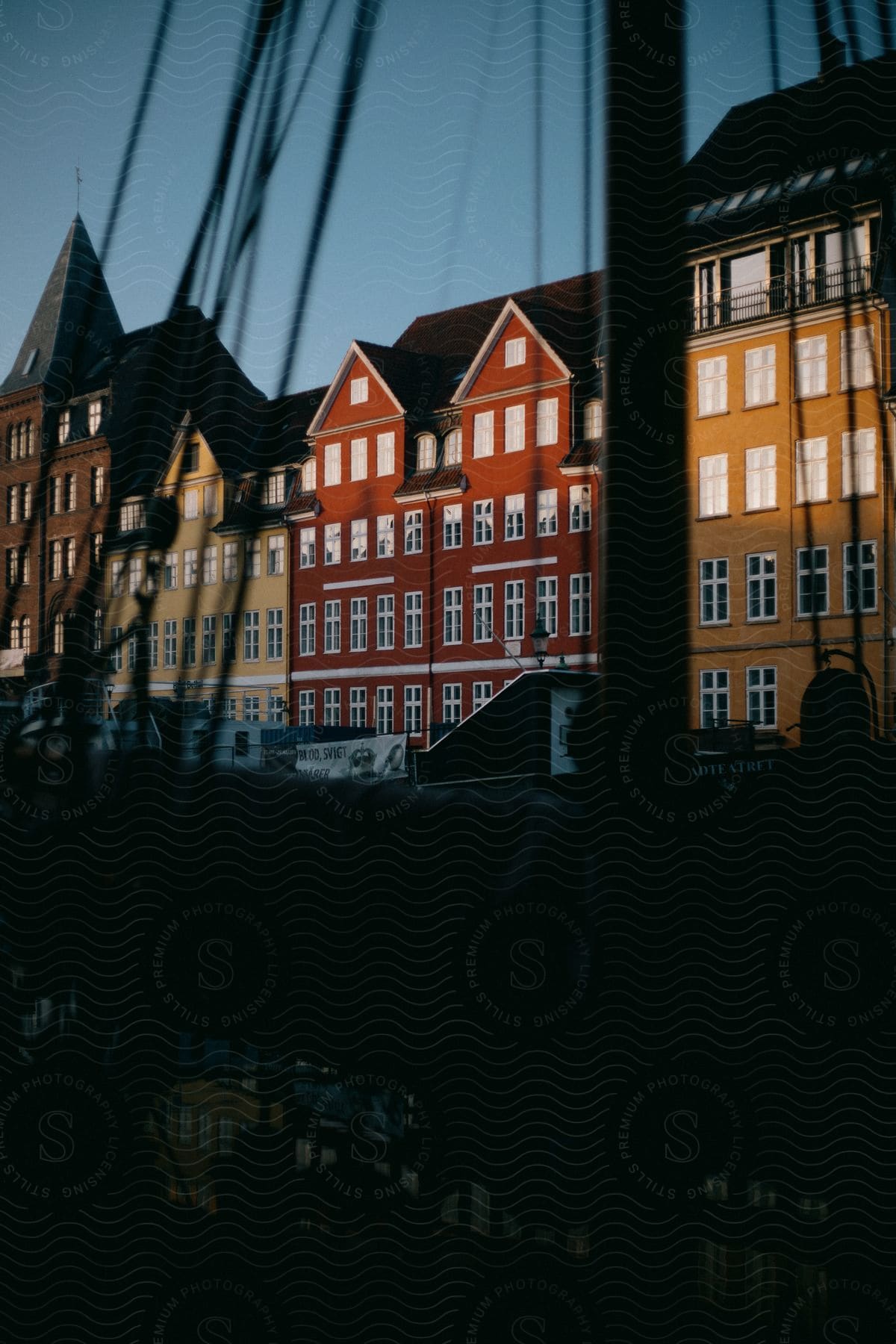 Colorful buildings line a city street in copenhagen