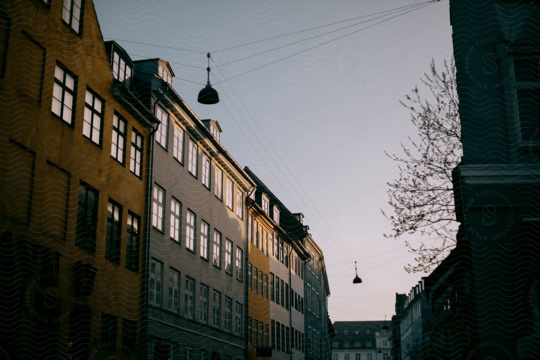 Wires are connected above a street between buildings in copenhagen