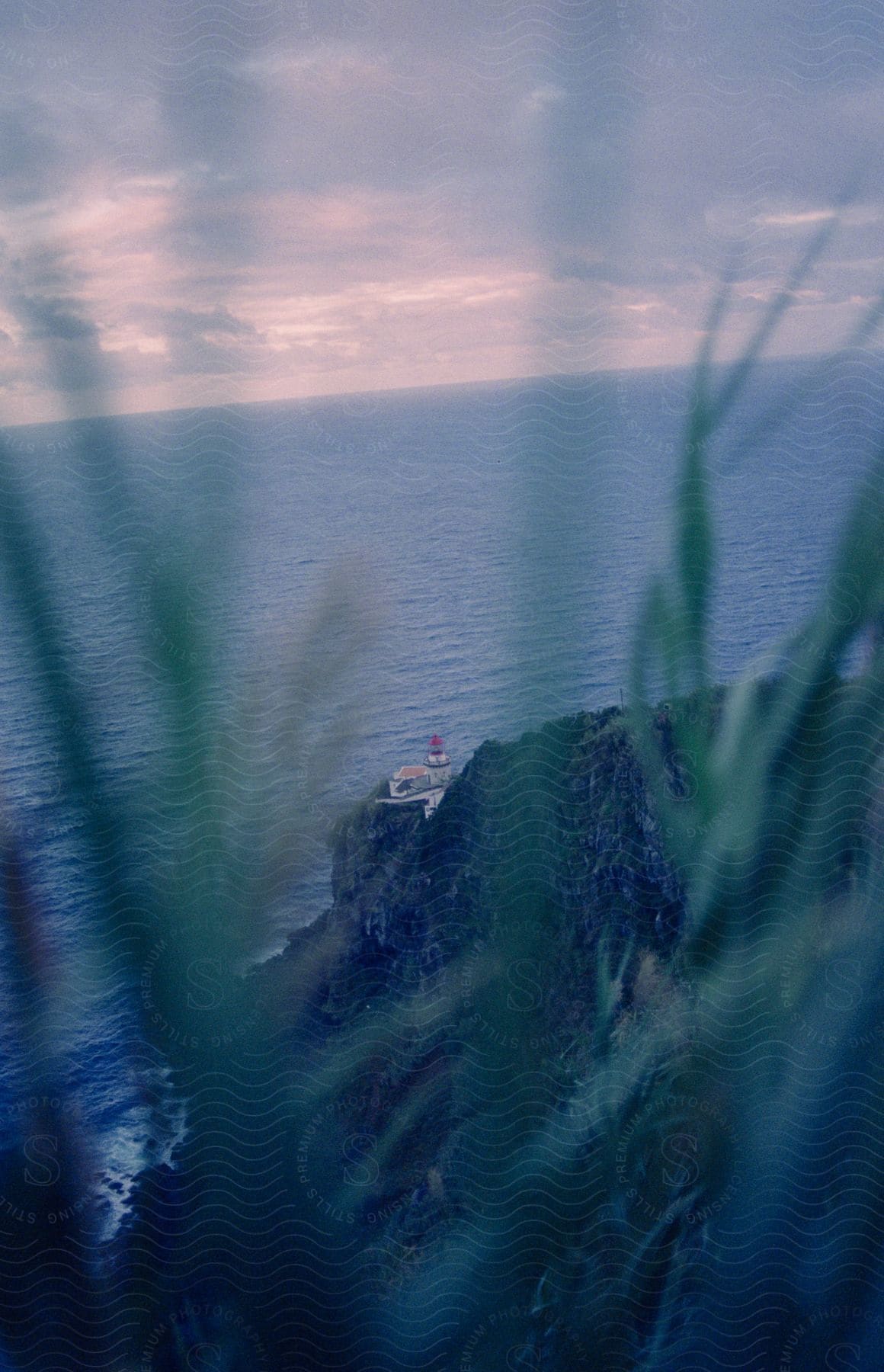 Lighthouse on a cliff overlooking the ocean