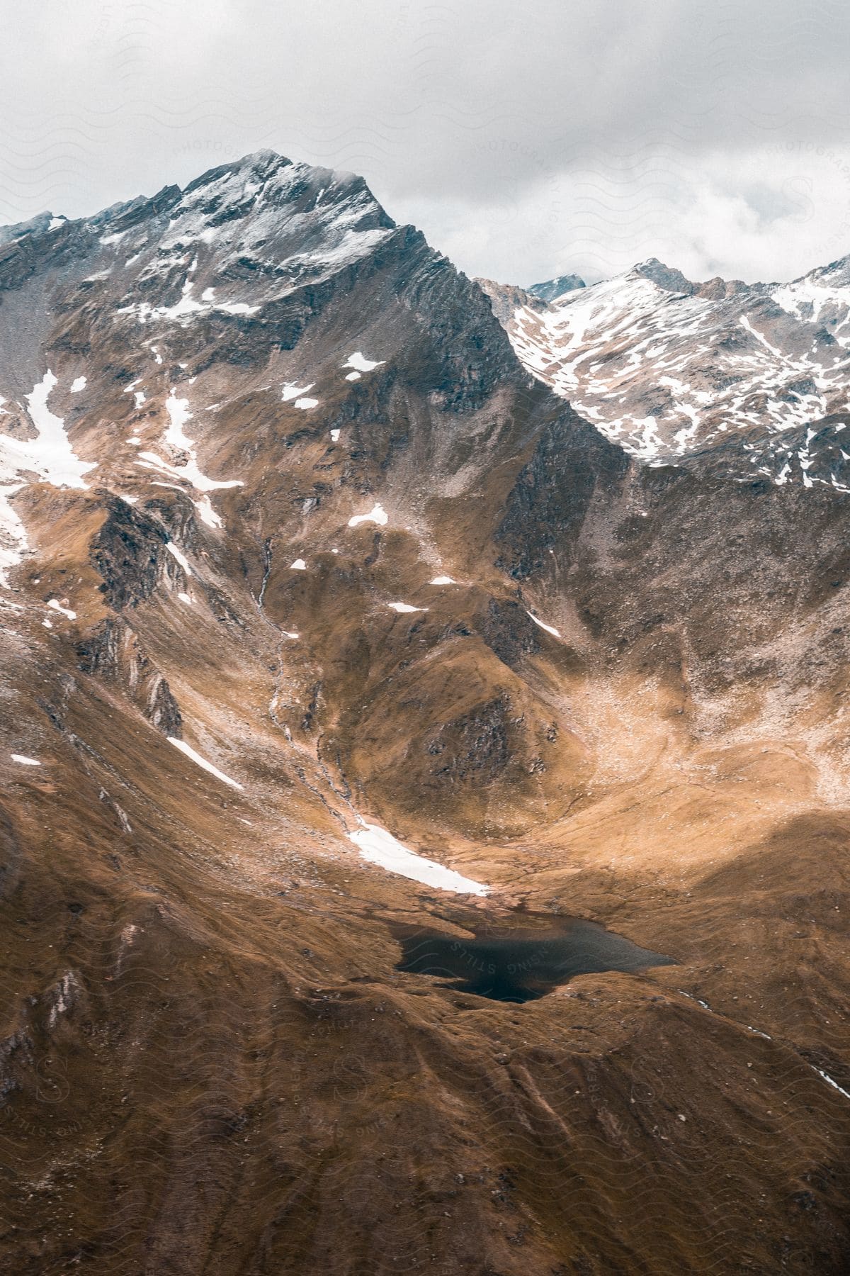 Landscape of small lake and rugged mountains in slovenia and austria