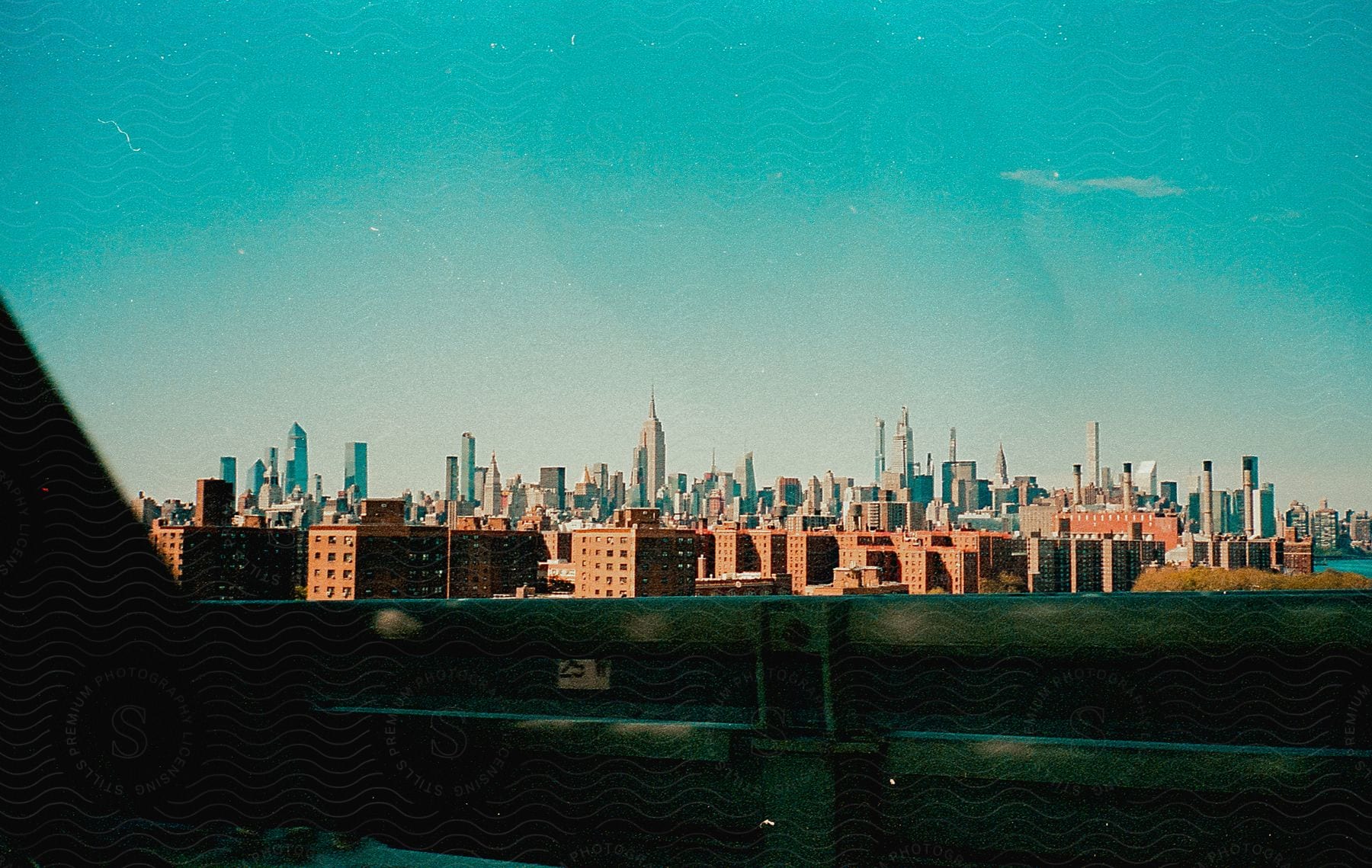 City skyline with high rise buildings and the williamsburg bridge in the distance