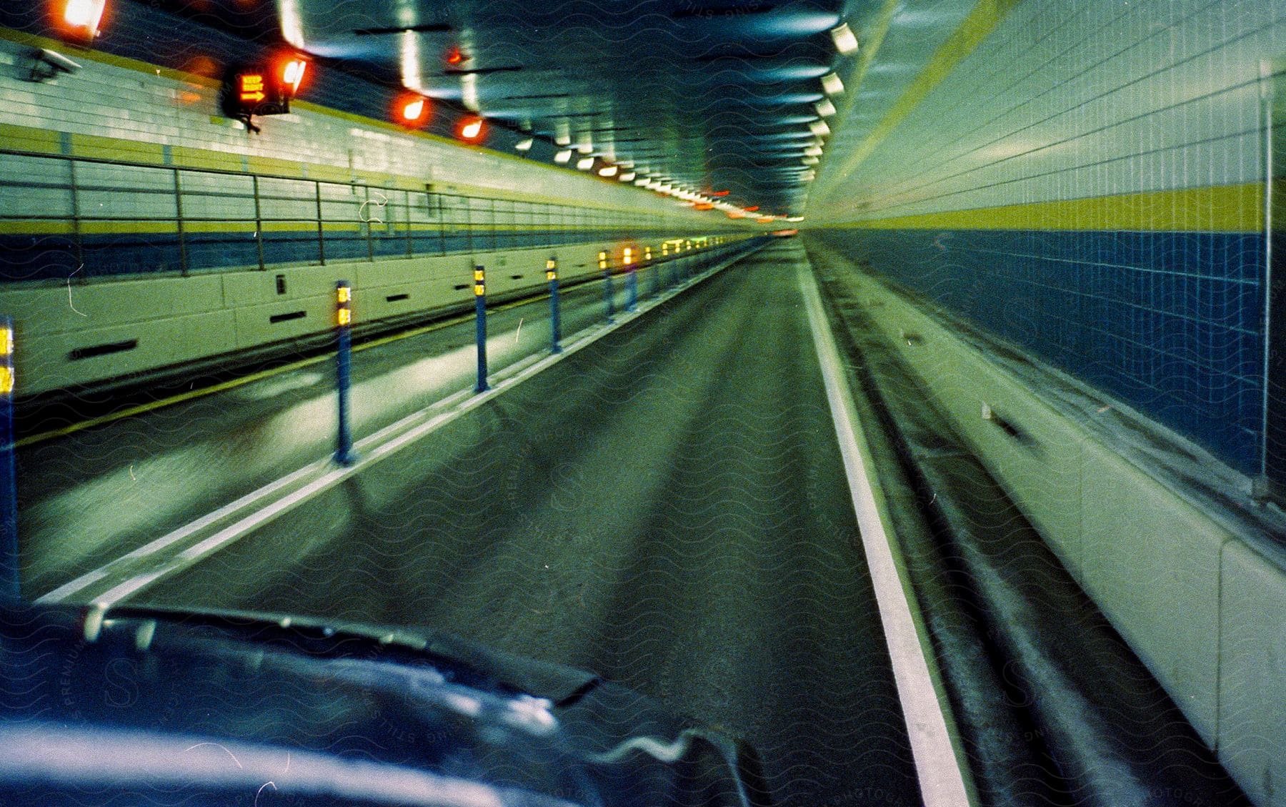 Illuminated tunnel seen from a moving vehicle