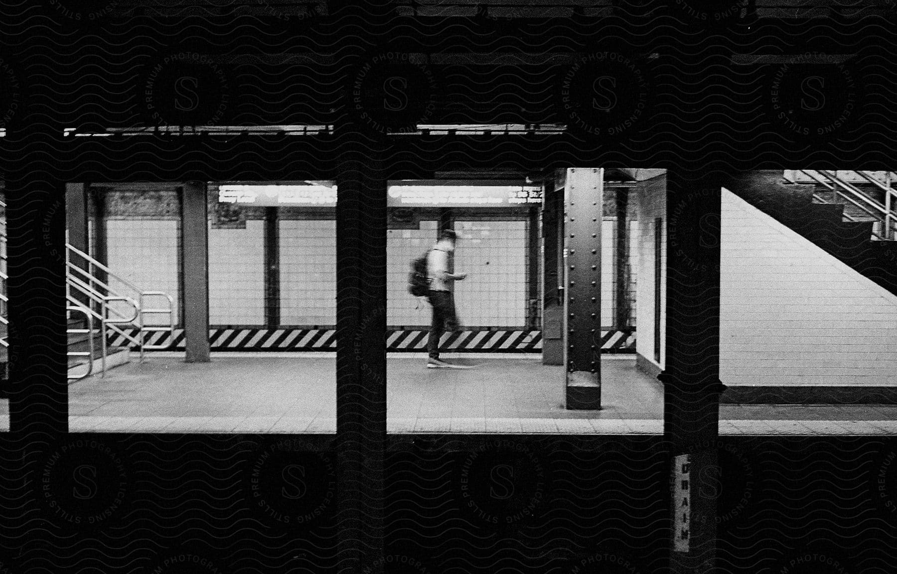 Man walking in a blurred metro station