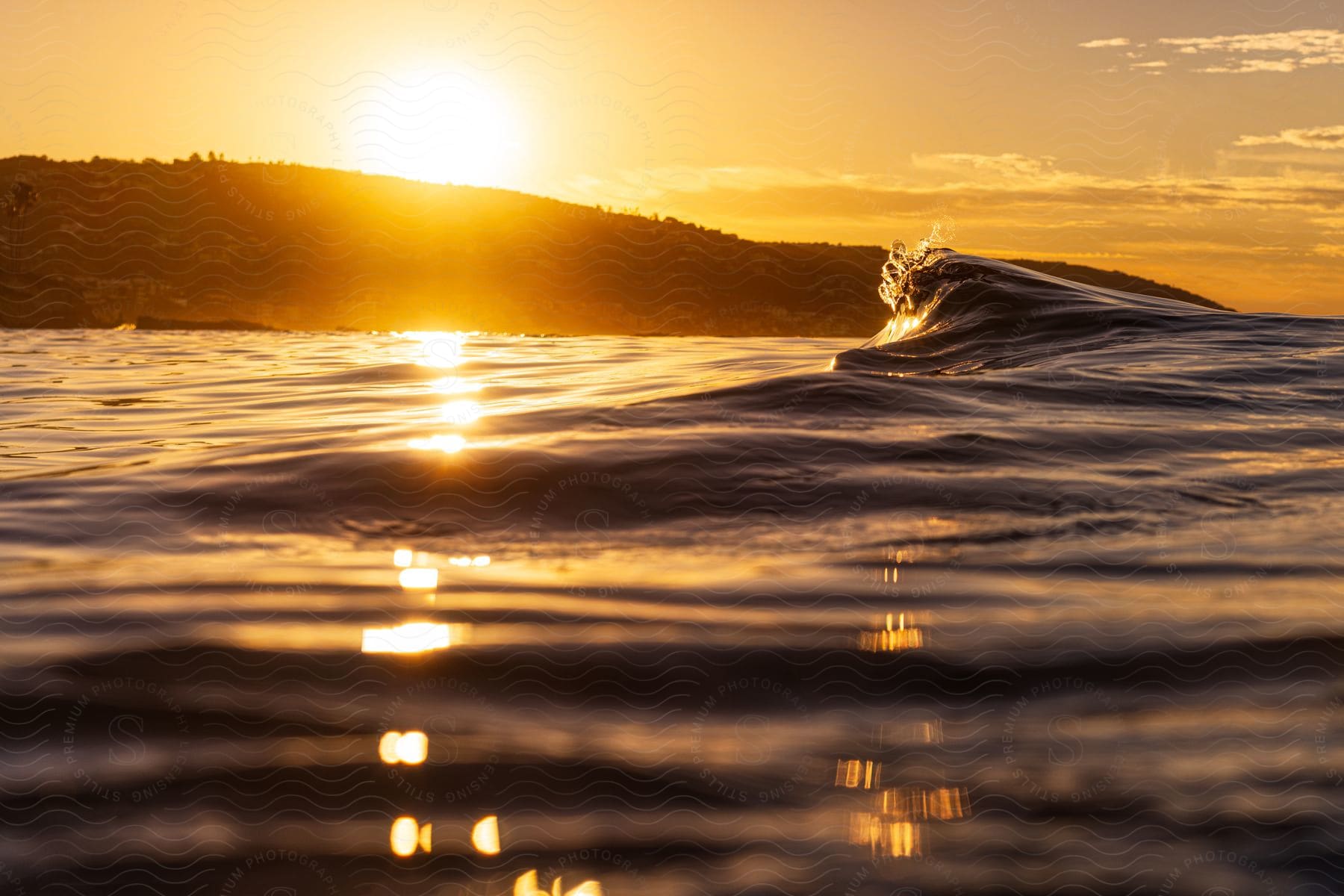 A serene sunrise over calm waves