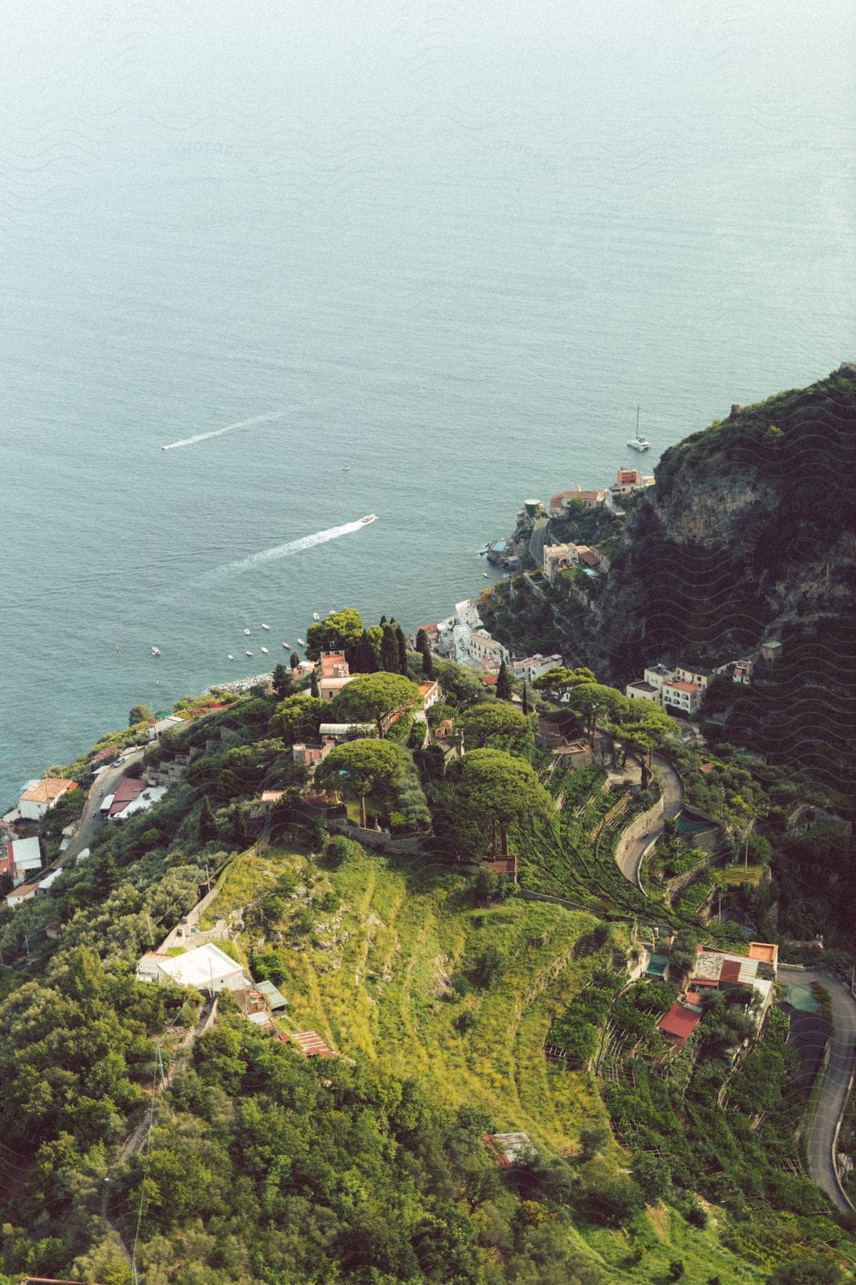 Coastal island with houses and open sea in the background