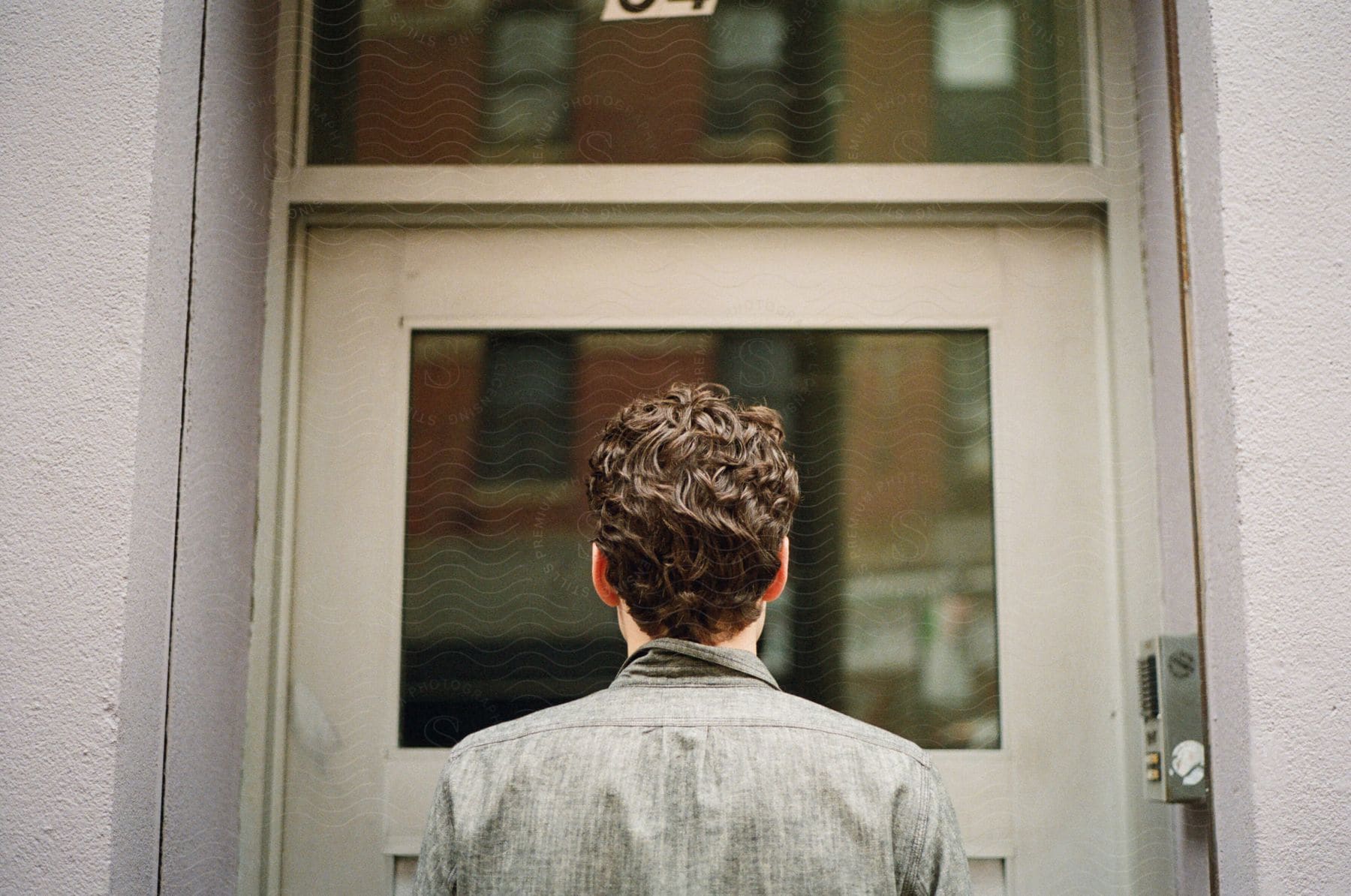 A man standing in front of a door