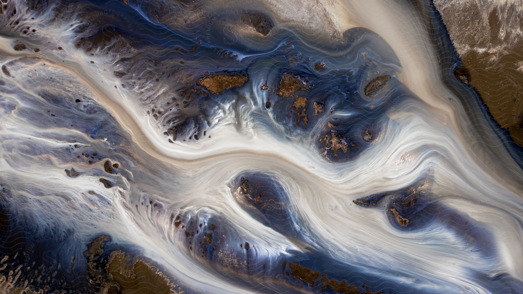 Abstract photo of clear fluid with blue brown and white highlights