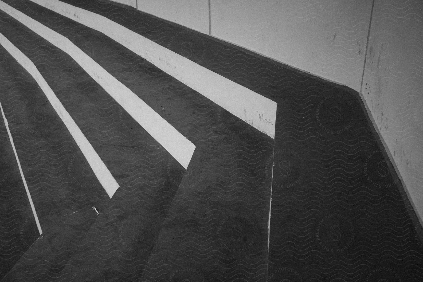 Concrete steps reflecting daylight creating a linear pattern