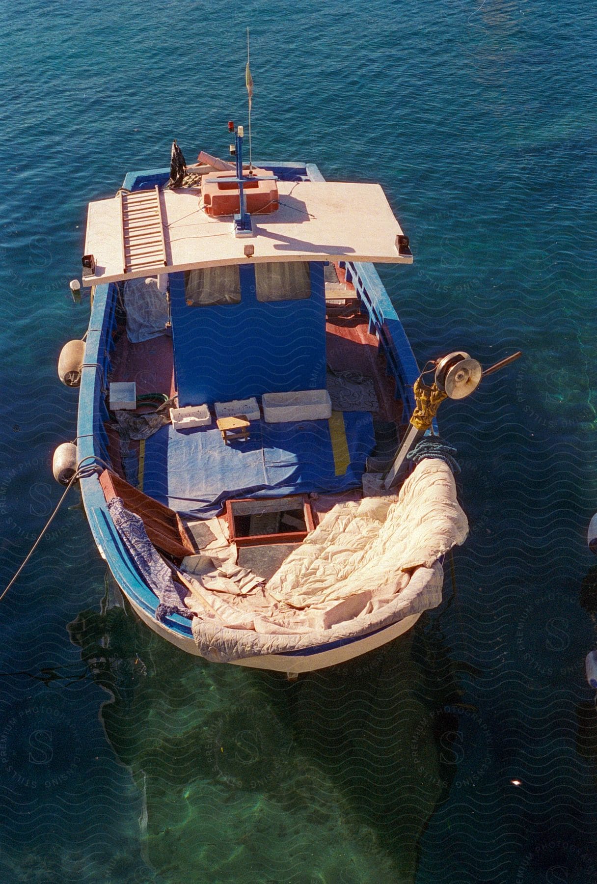 Fishing vessel floating on water along the coast