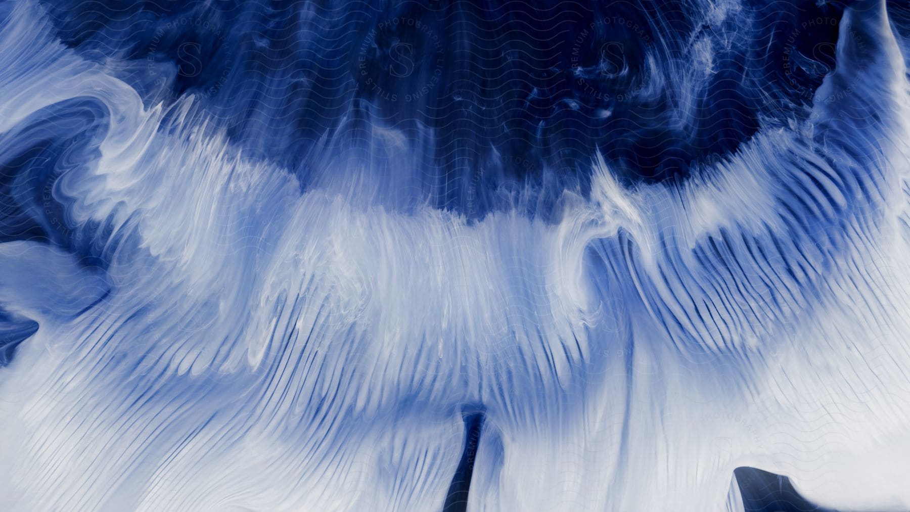 A closeup of a blue and white abstract painting