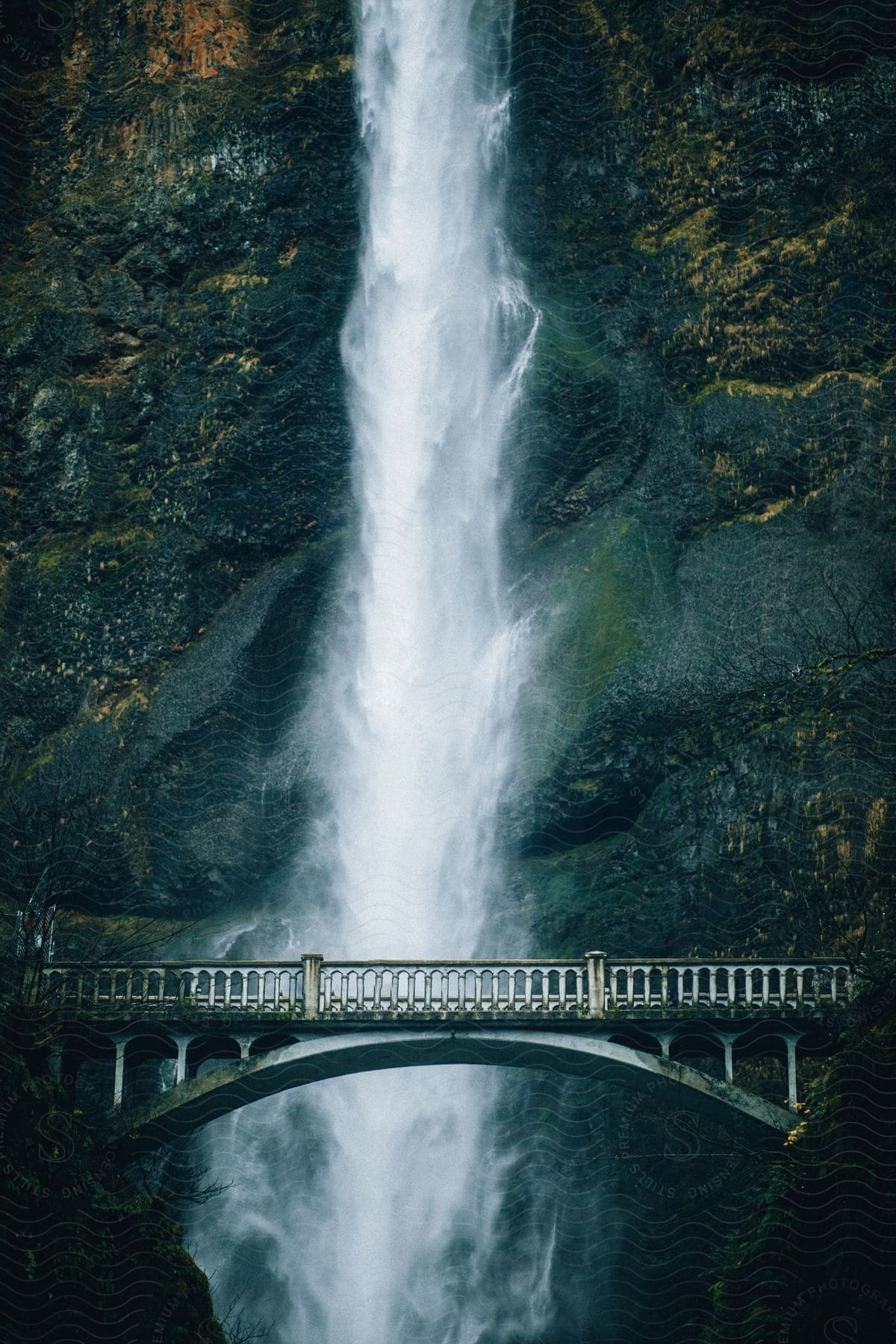 A majestic mountain with cascading water creating a mesmerizing flow