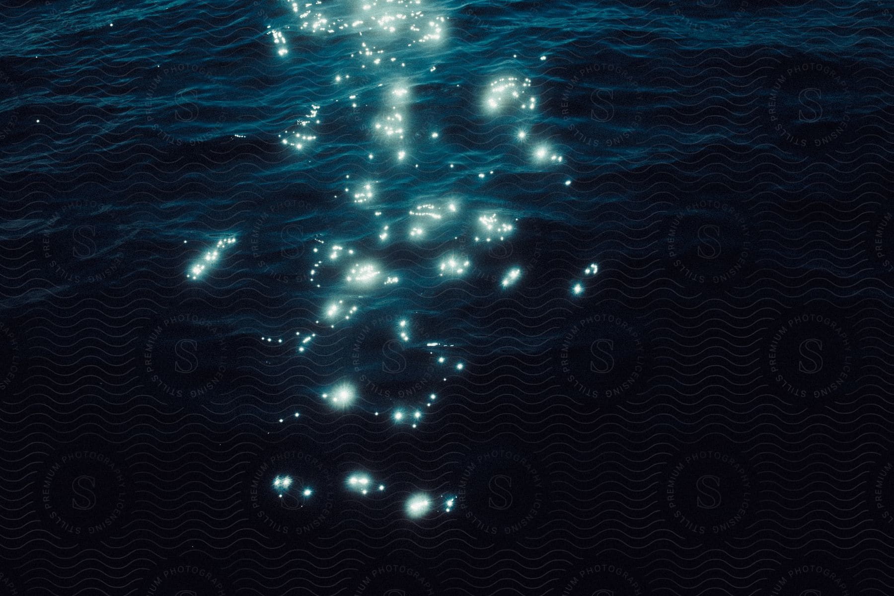 Lights reflected on water at night time