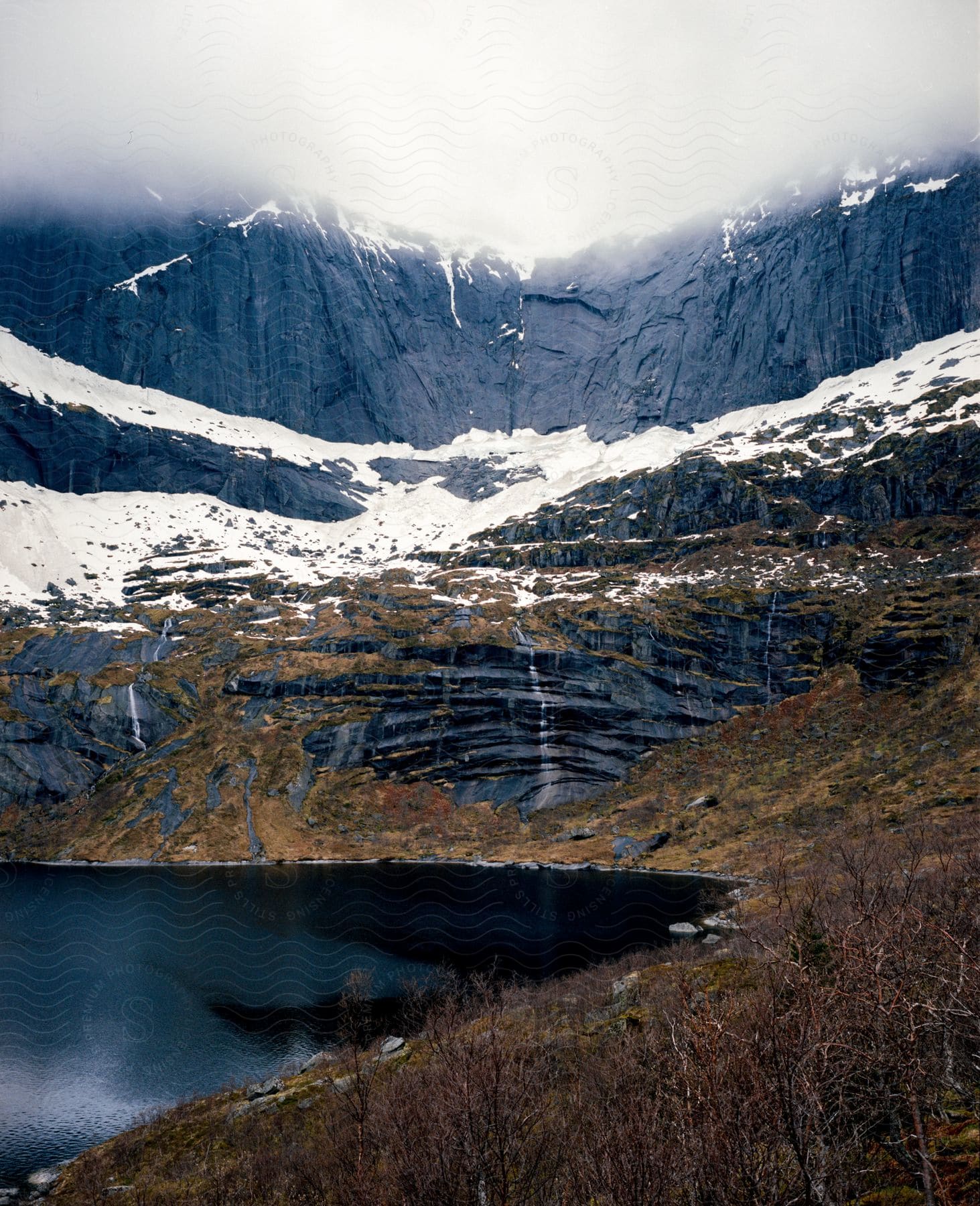 A serene lake surrounded by mountains in norway