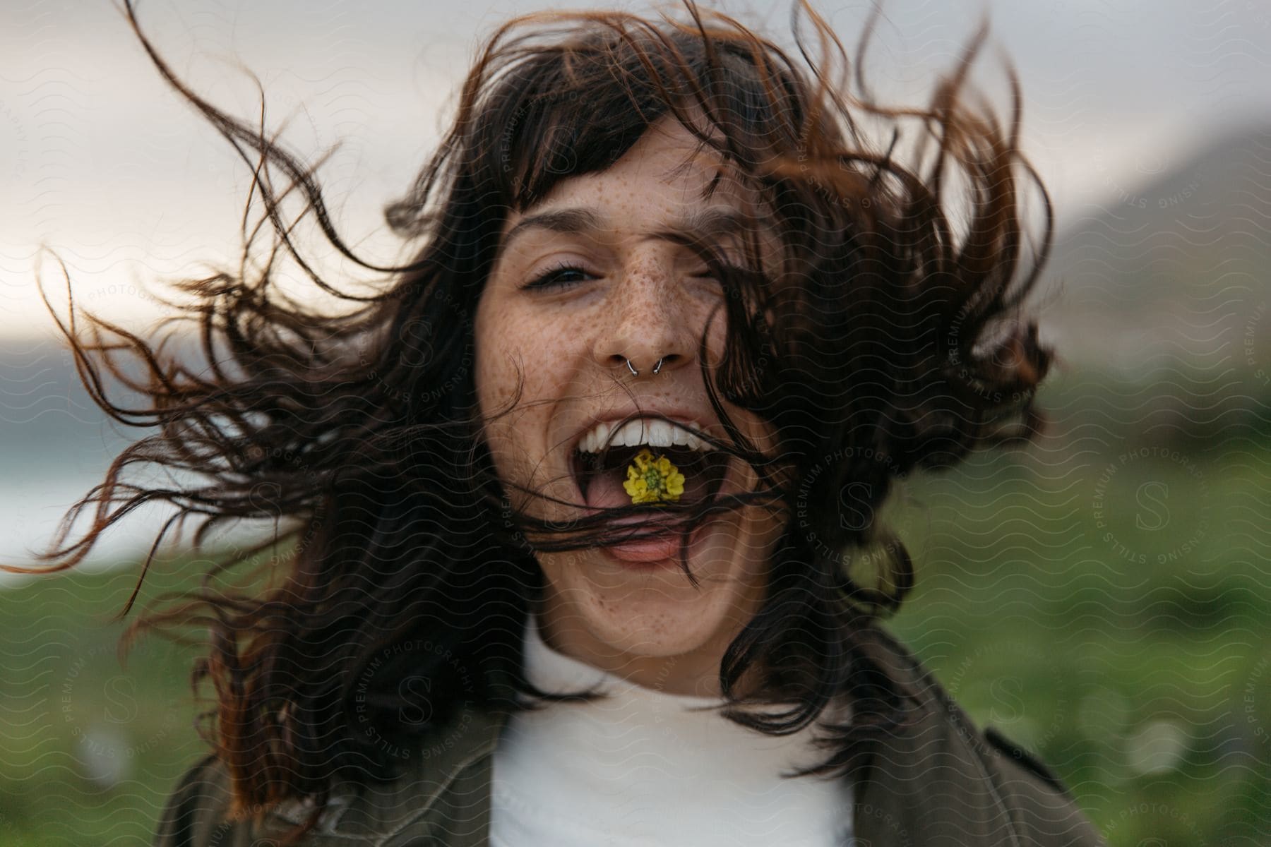 A happy woman with a smile in nature