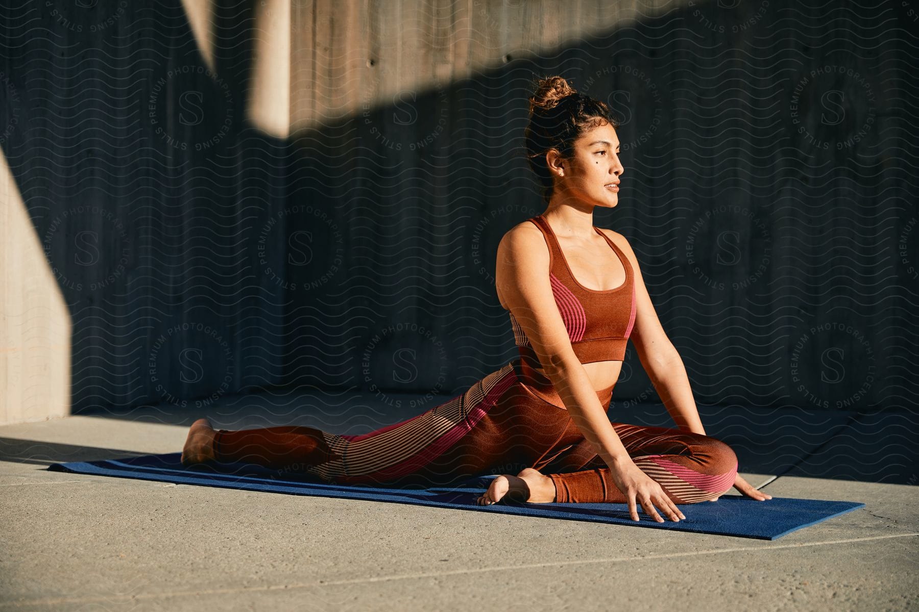 A determined woman in sportswear competes in a fitness activity