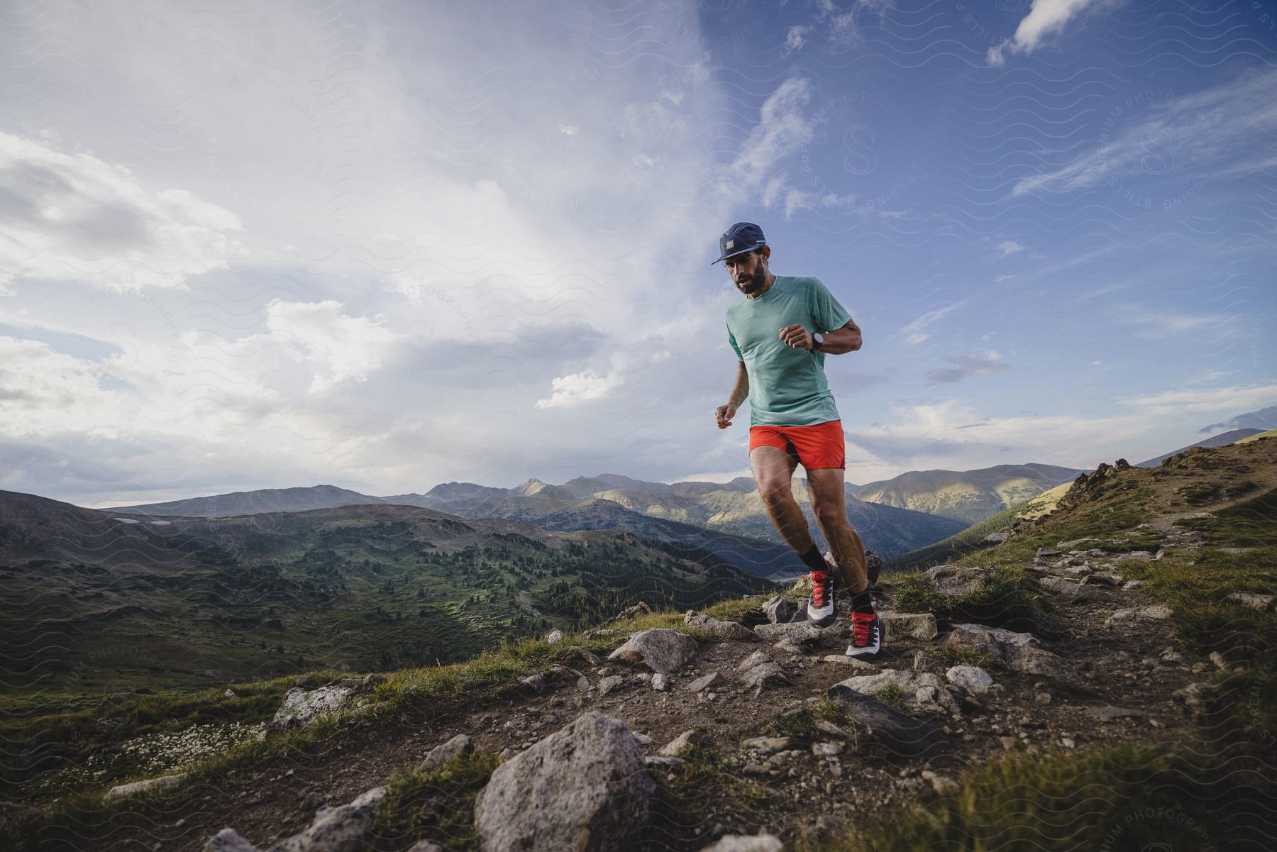 A man running outdoors on a trail