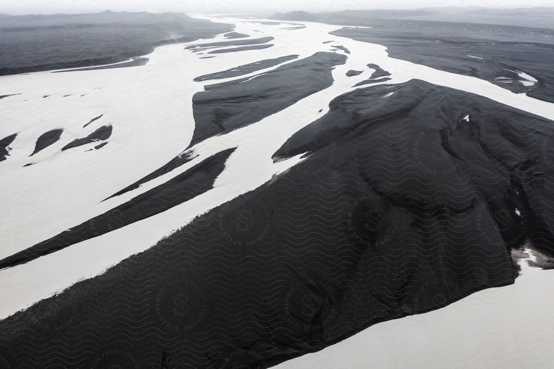 Aerial view of a snowy landscape with water resources