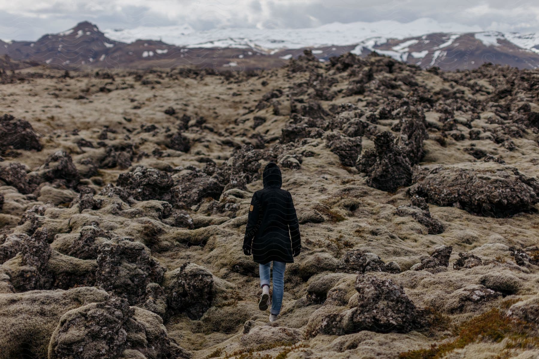 A person walking in the mountains of iceland