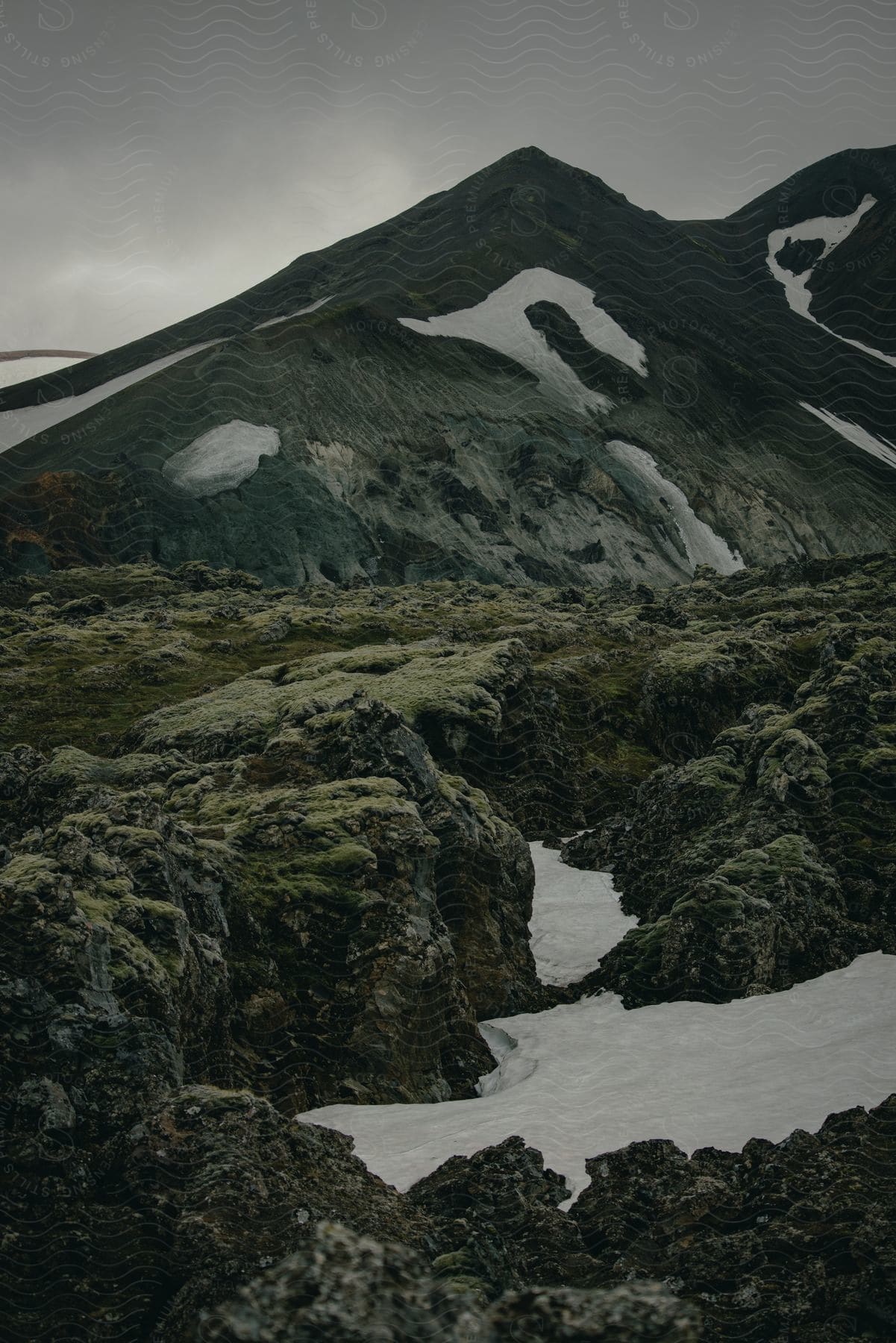 A serene landscape of the icelandic highlands with water mountains vegetation and wilderness