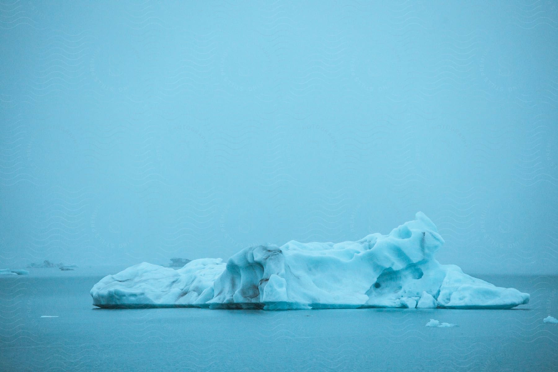 A big iceberg in the middle of the ocean