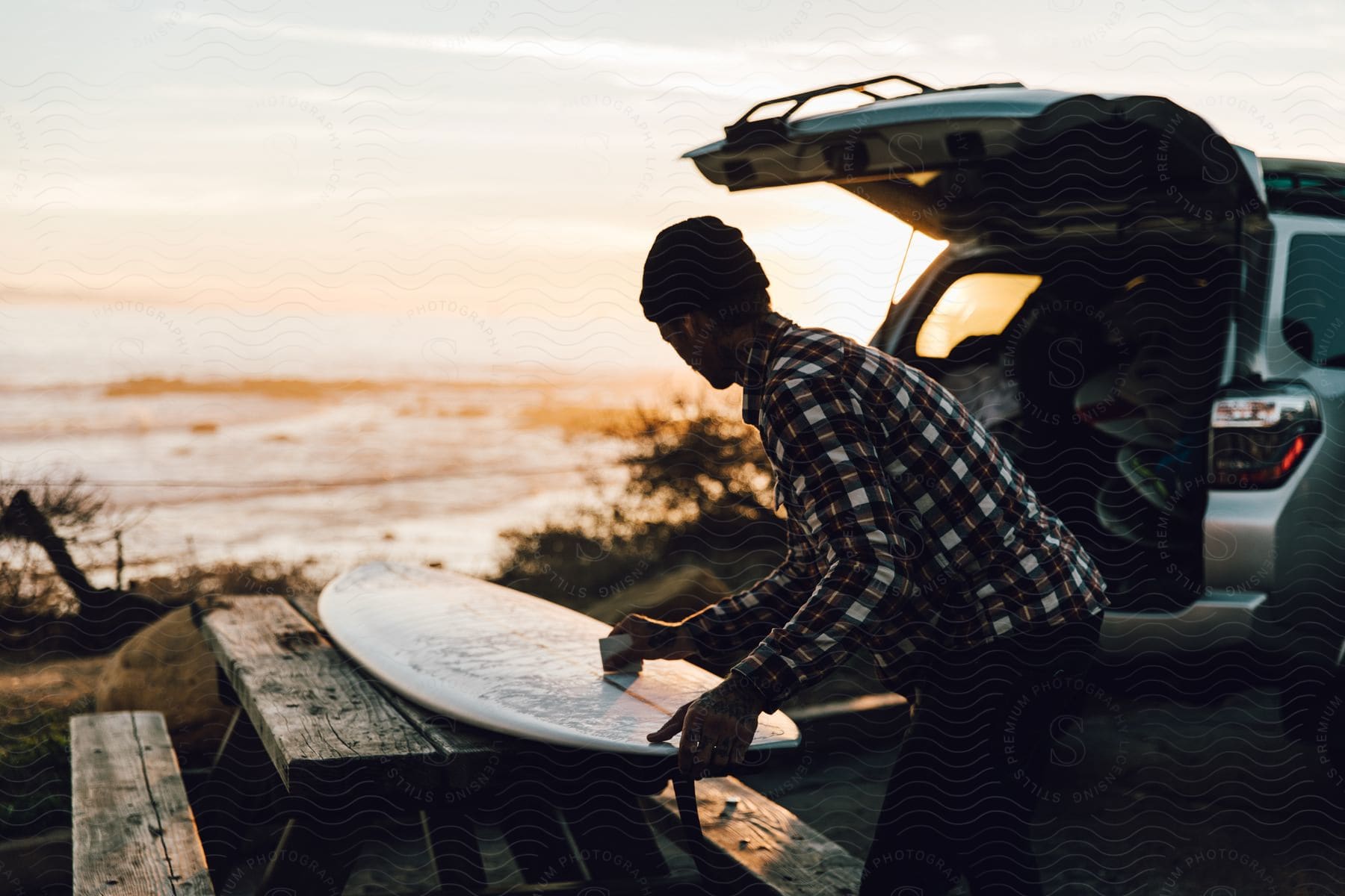 A man surfing on a surfboard in the ocean