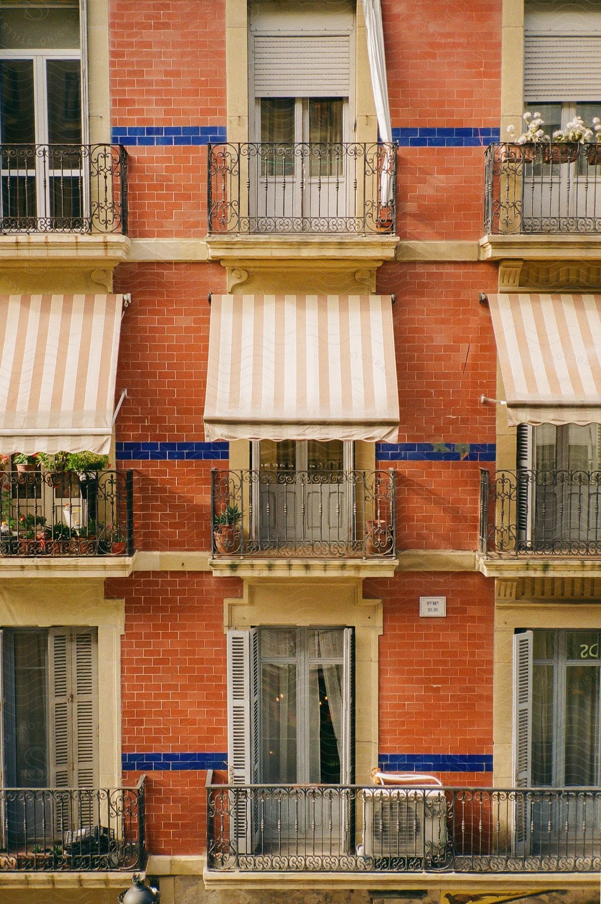 Facade of a parisian apartment with small closeknit balconies