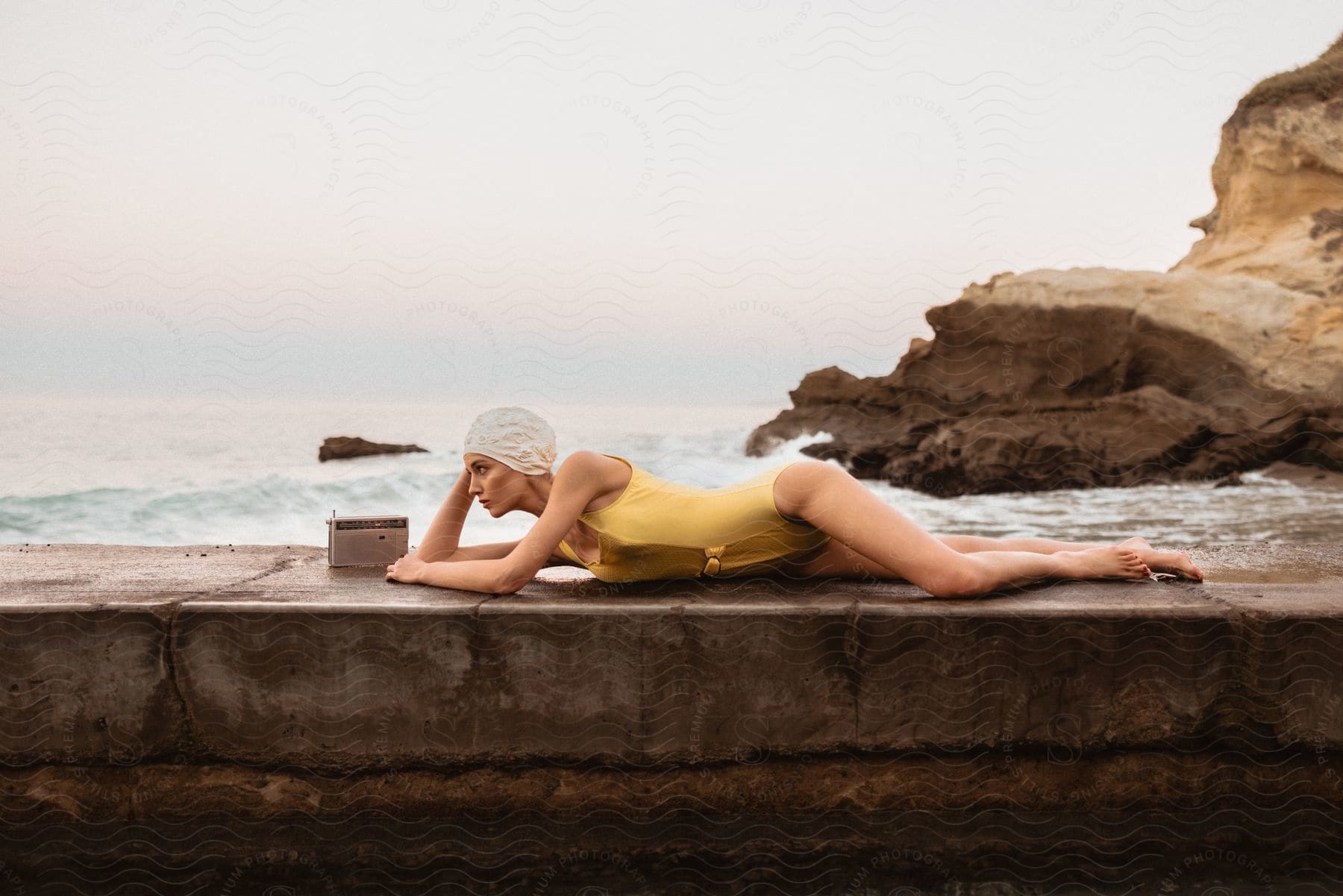 A woman sunbathing on the beach