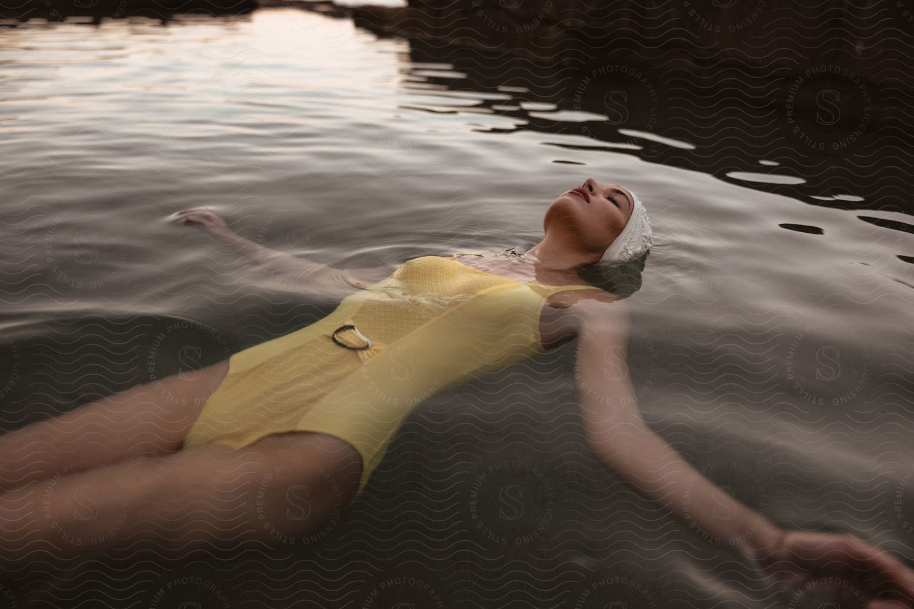 A woman swimming in a body of water