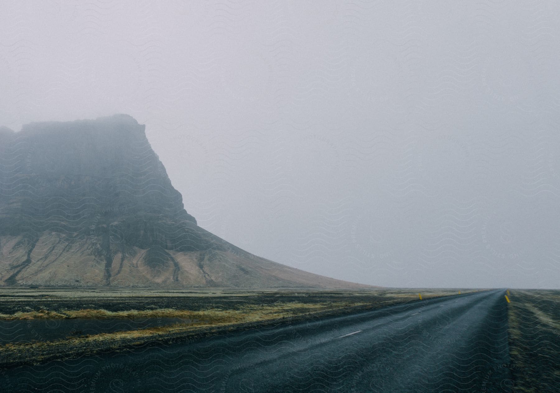 A mountain near a road in iceland