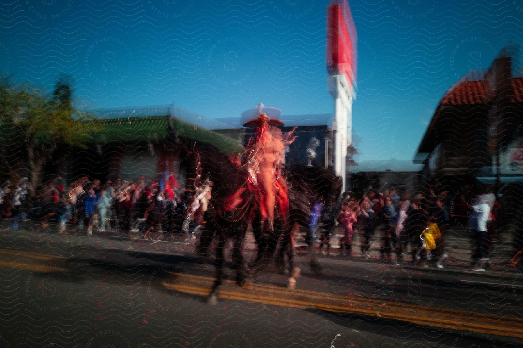 A bustling community gathers on the street in the evening