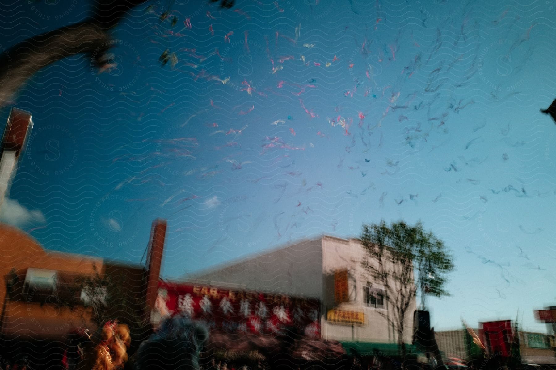An evening scene in a community with particles floating in the air