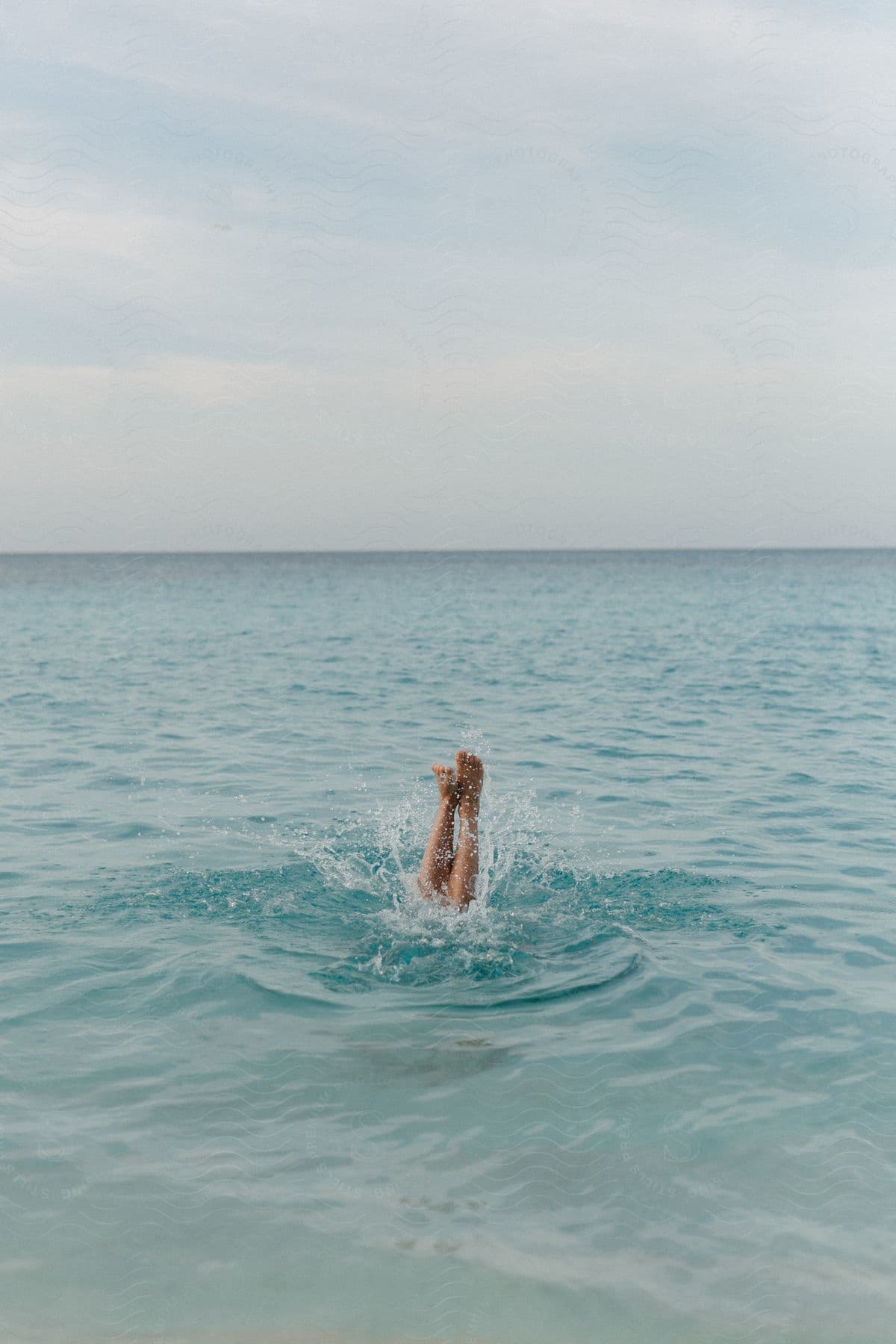 A person enjoying a swim in the sea at the beach