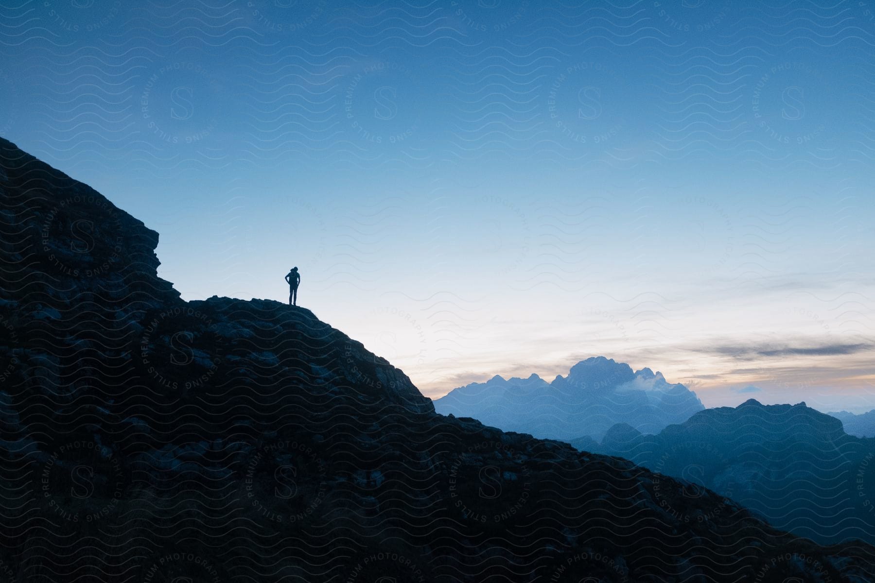 A man standing on a mountain in slovenia