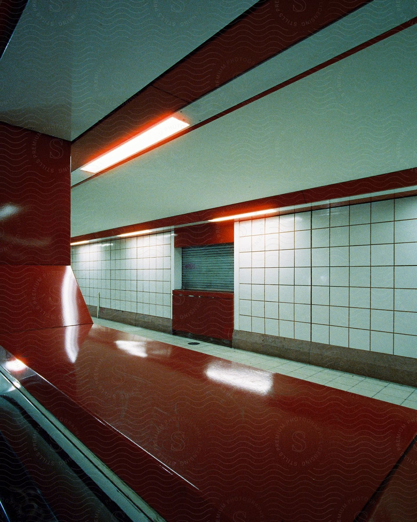 A building with a unique red and white wall design featuring an intricate pattern