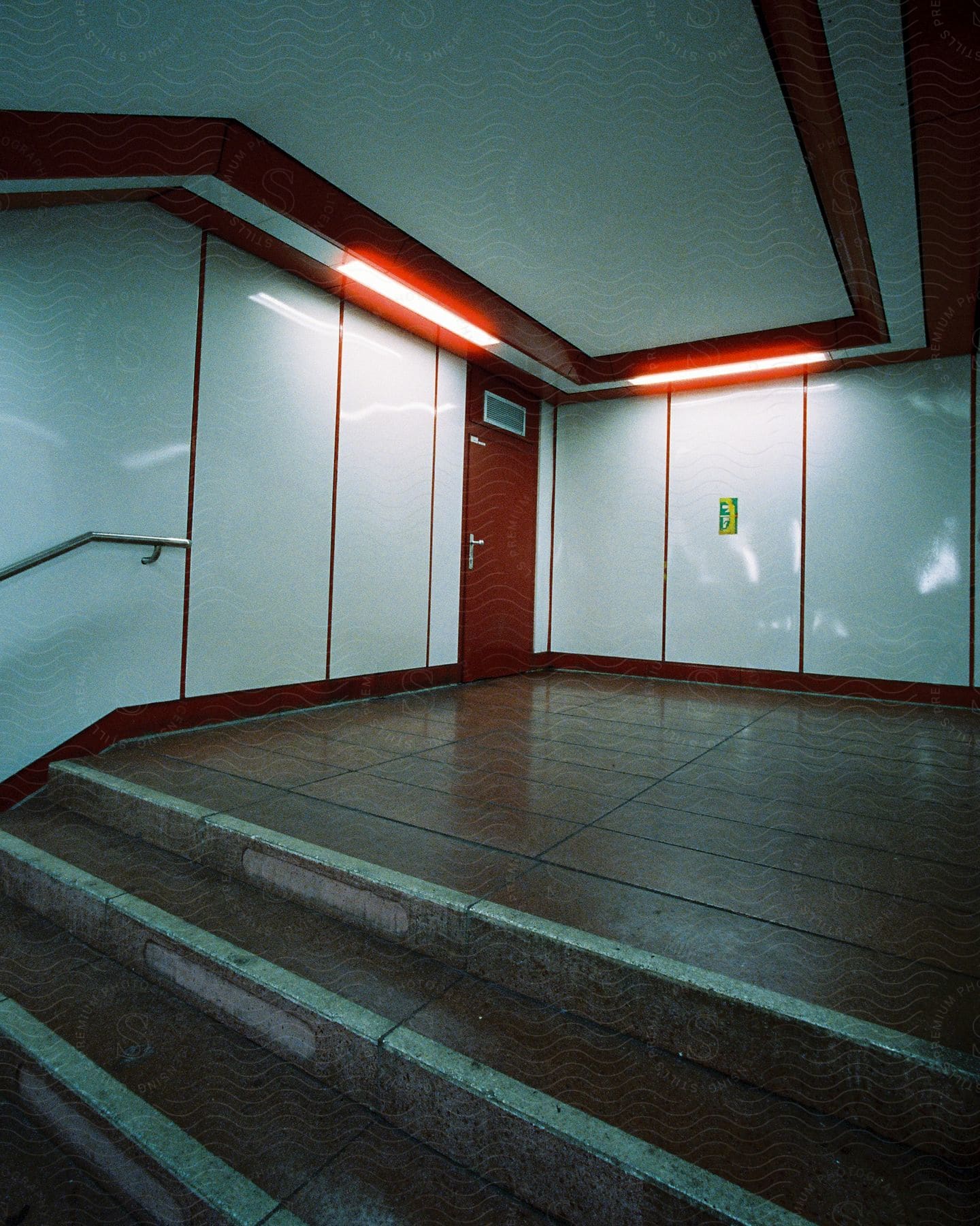 Indoor wooden architecture with a door and fixtures