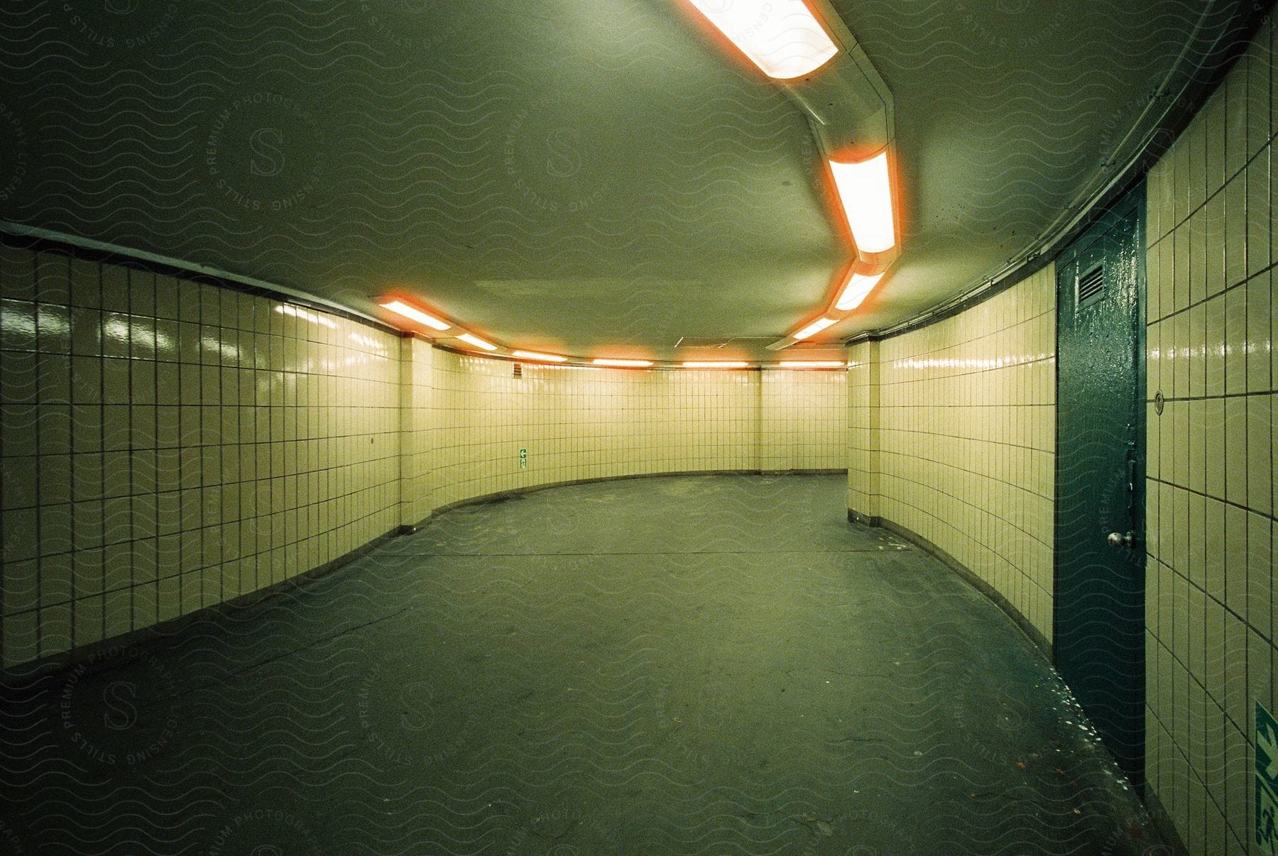 A lamp in an indoor room with a train tunnel