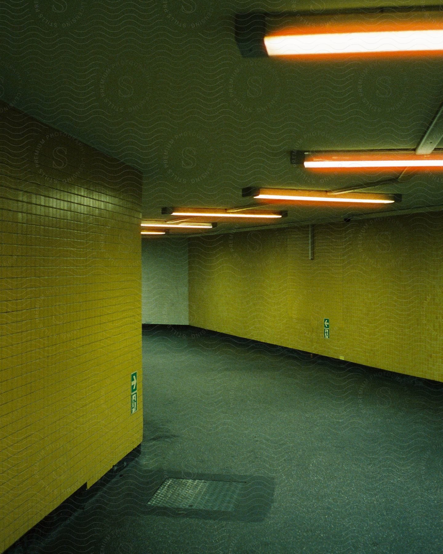 Indoor passage to a station with architecture flooring and lighting